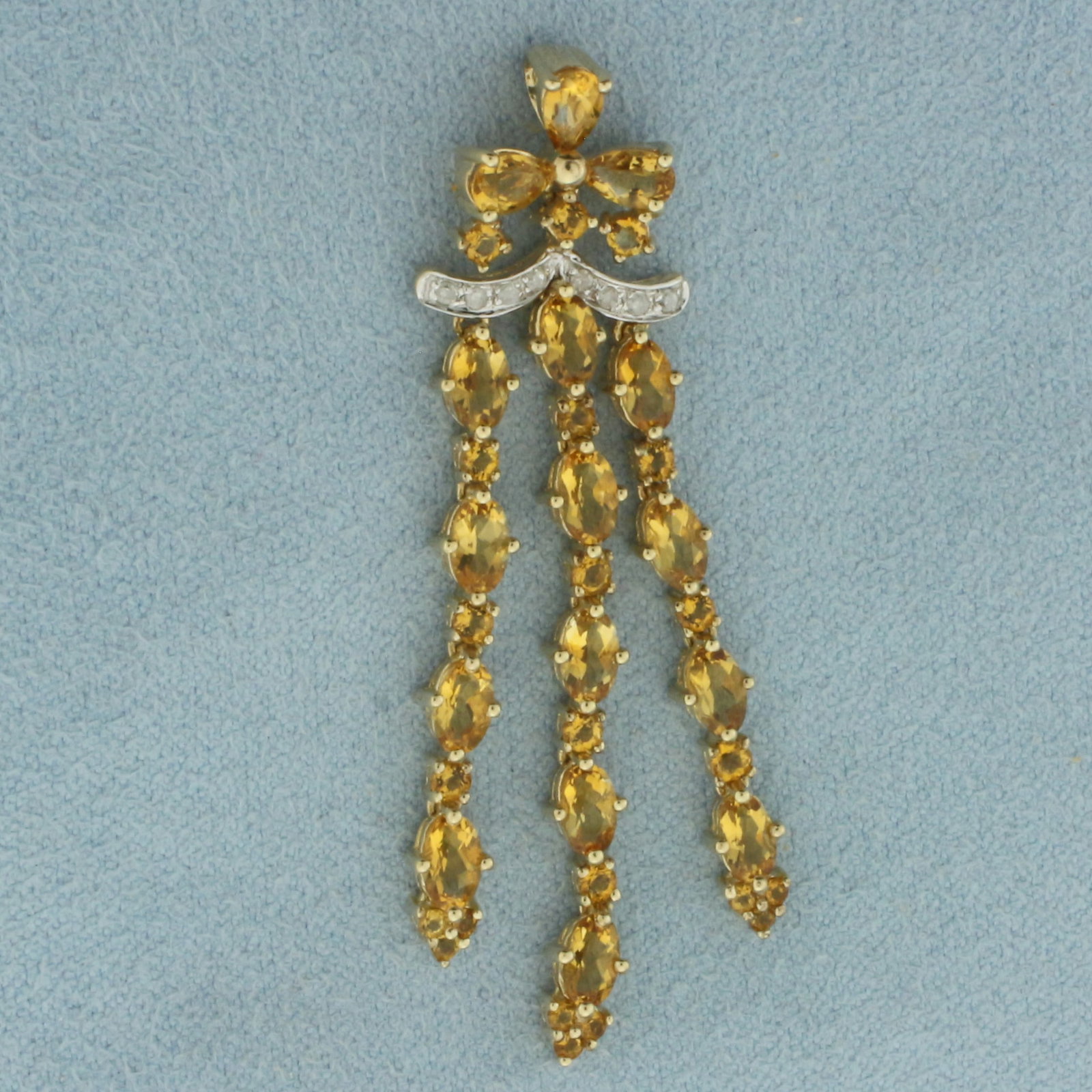 Citrine and Diamond Dangle Pendant in 10K Yellow Gold: In 10k yellow gold. 2 inches long by 5/8 inches wide. Contains 3 pear cut Citrine, 5x3mm each, 13 oval cut Citrine, 2mm each, and 9 round cut Citrine, 1.5mm each, all high quality natural gemstones wi