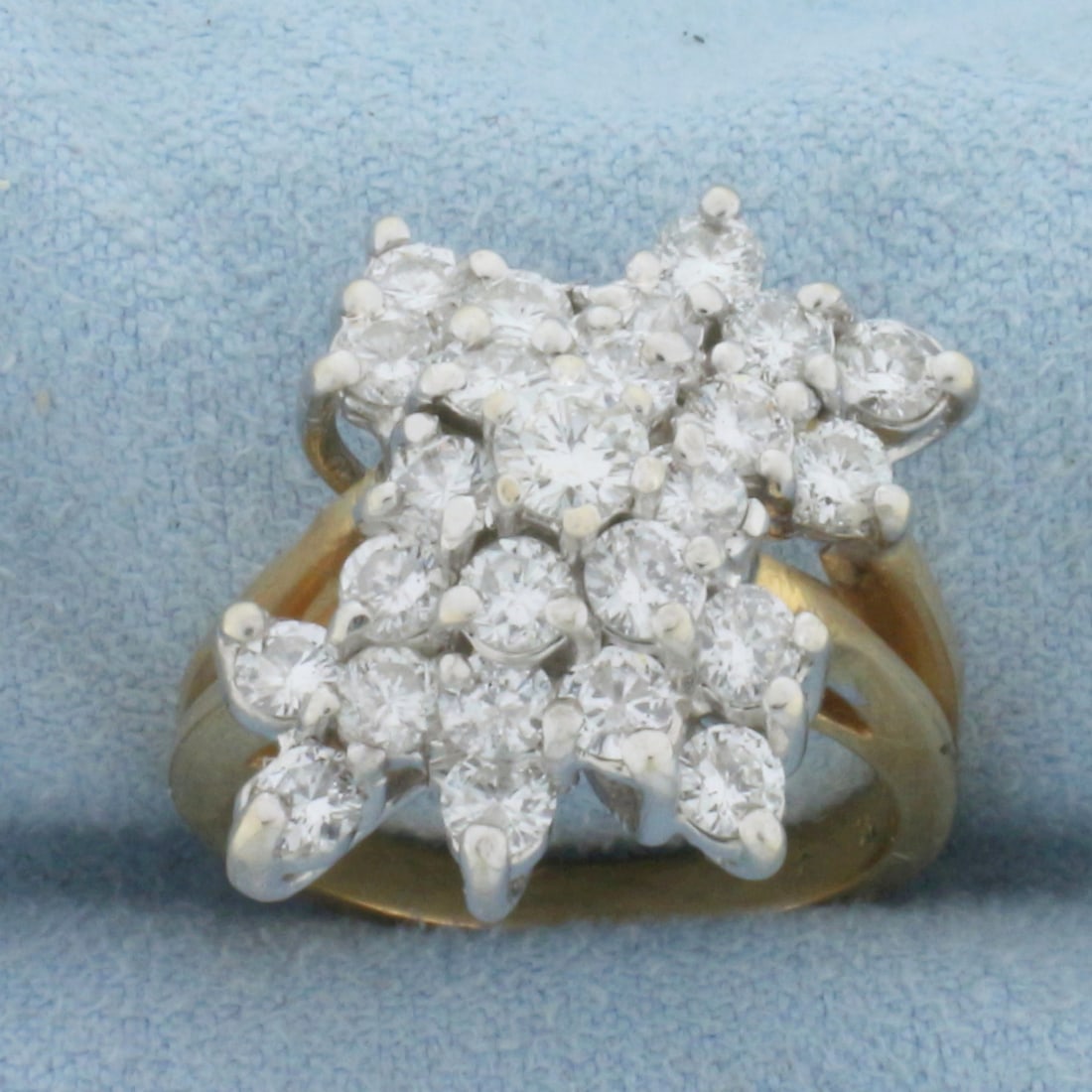 Vintage Diamond Cocktail Ring in 14k Yellow Gold: In 14k yellow gold. Center diamond is a high quality .25ct diamond surrounded by twenty four .075ct diamonds. 2ct TW. All diamonds are SI1clarity/F color, completely eye clean, and very white with exc