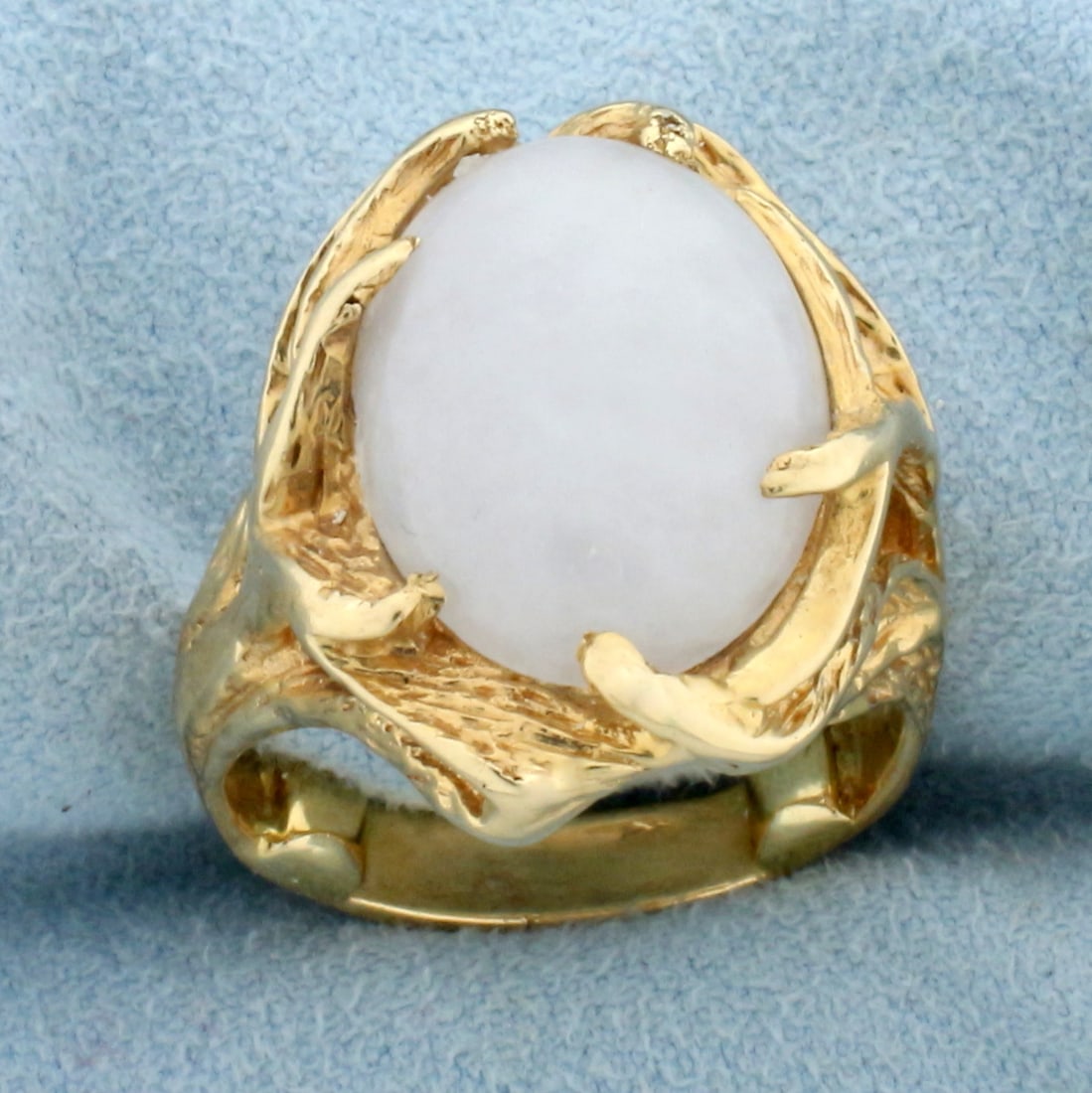 White Jade Solitaire Serenity Ring in 14K Yellow Gold: In 14K Yellow Gold. Contains a high quality natural 16x12mm cabochon oval White Jade gemstone with excellent clarirty and high luster. White jade is associated with serenity and peace. Size 7. 12.6g
