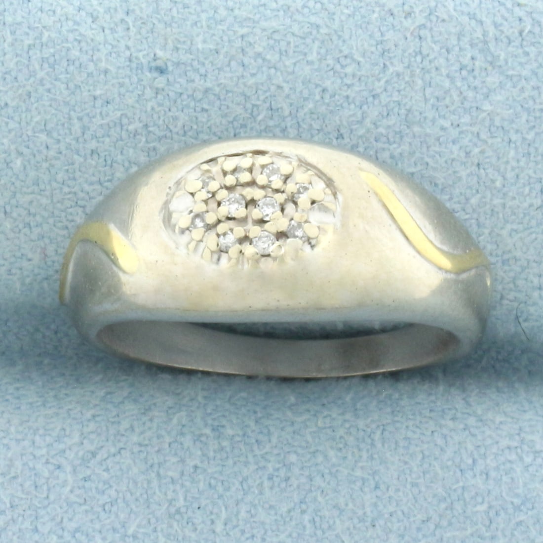 Diamond Pave Wave 2-Tone Ring in 14k White Gold with 14k Yellow Gold Accent: in 14k White Gold with 14k Yellow Gold Accent. Contains ten high quality .01ct diamonds, VS clarity/G color. 4.9g.