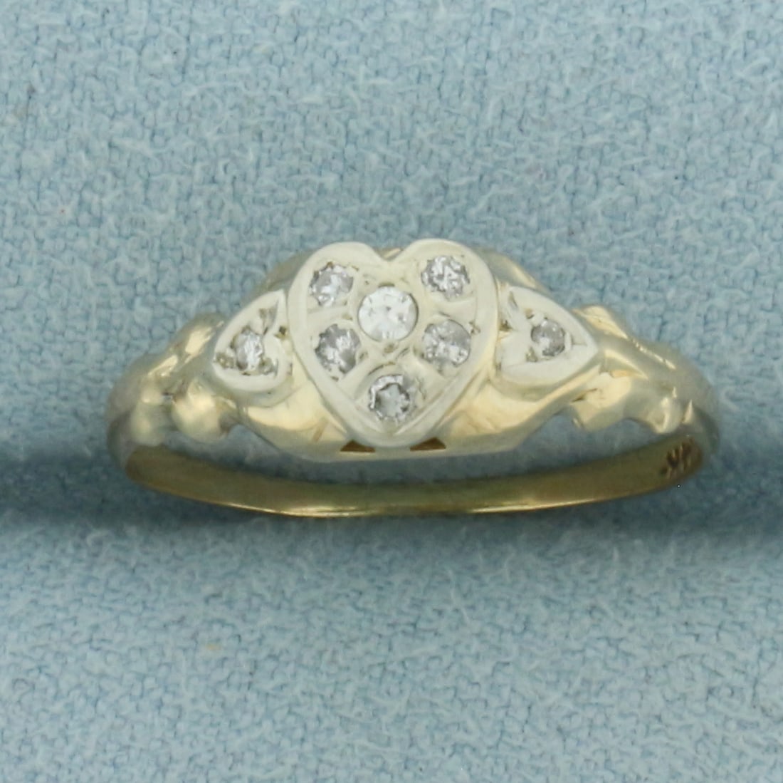 Antique Diamond Heart Ring in 14K Yellow and 14K White Gold: In 14k yellow and 14k white gold. 6.3mm wide at top of ring. Contains one 0.02ct, five 0.01ct, and two 1/2pt high quality diamonds. Size 6. 1.0g.