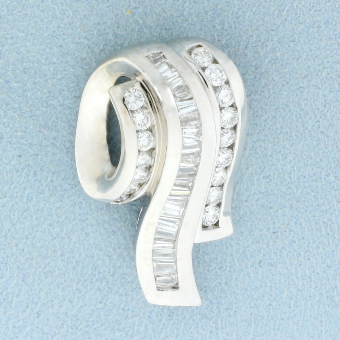 Modern Baguette and Round Diamond Pendant or Slide in 14K White Gold: In 14K White Gold. Contains sixteen round and twenty baguette high quality diamonds, 2ct TW, VS clarity/G color. 1 1/4 inches long, 3/4 inch wide. 10.7g.