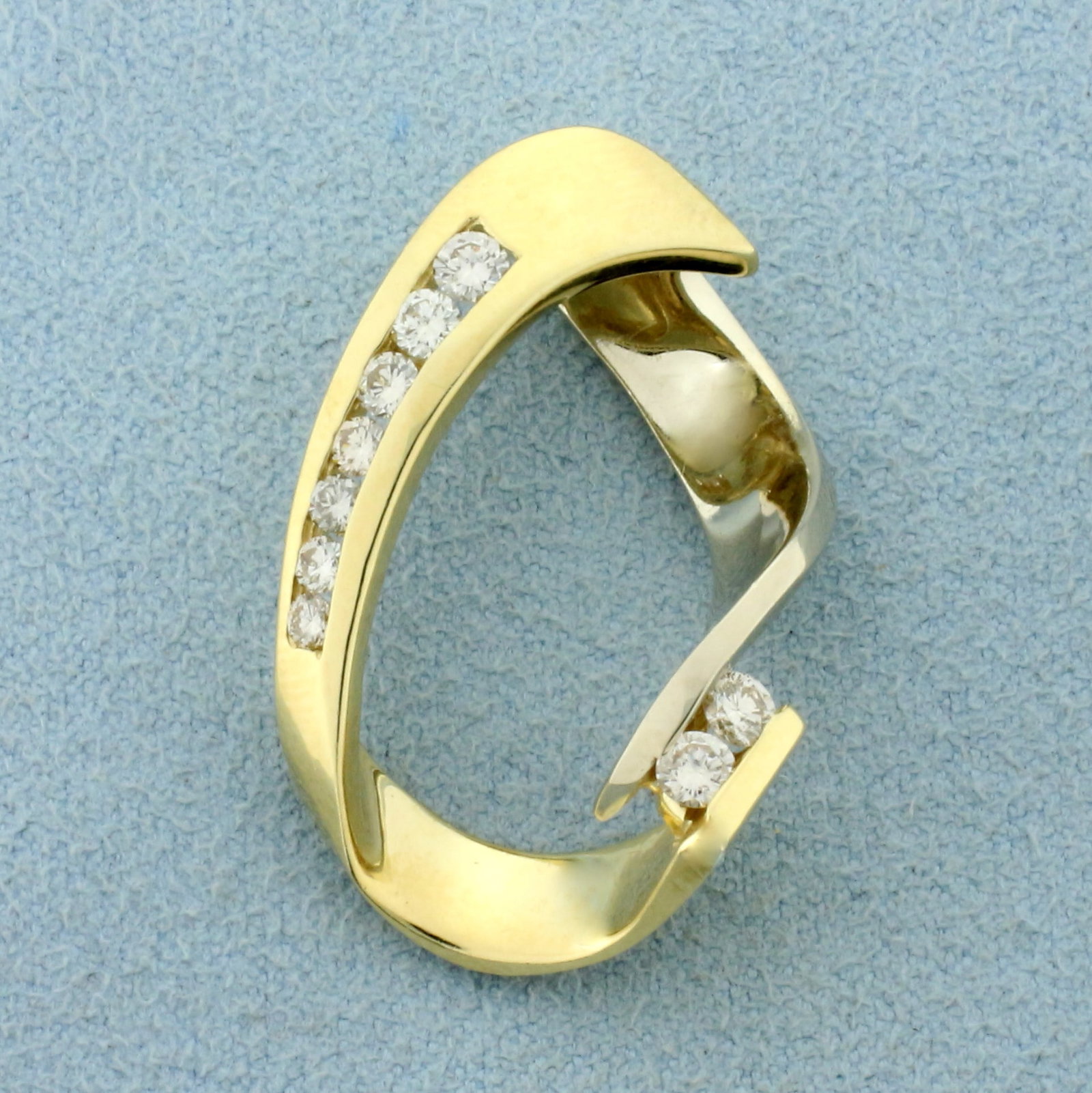 Modern Abstract Design Diamond Pendant or Slide in 14K Yellow Gold: In 14K Yellow Gold. Contains two nine high quality diamonds, 1/2ct TW, SI clarity/H color. 1 1/8 inches long, 3/4 inch wide. 7.2g.