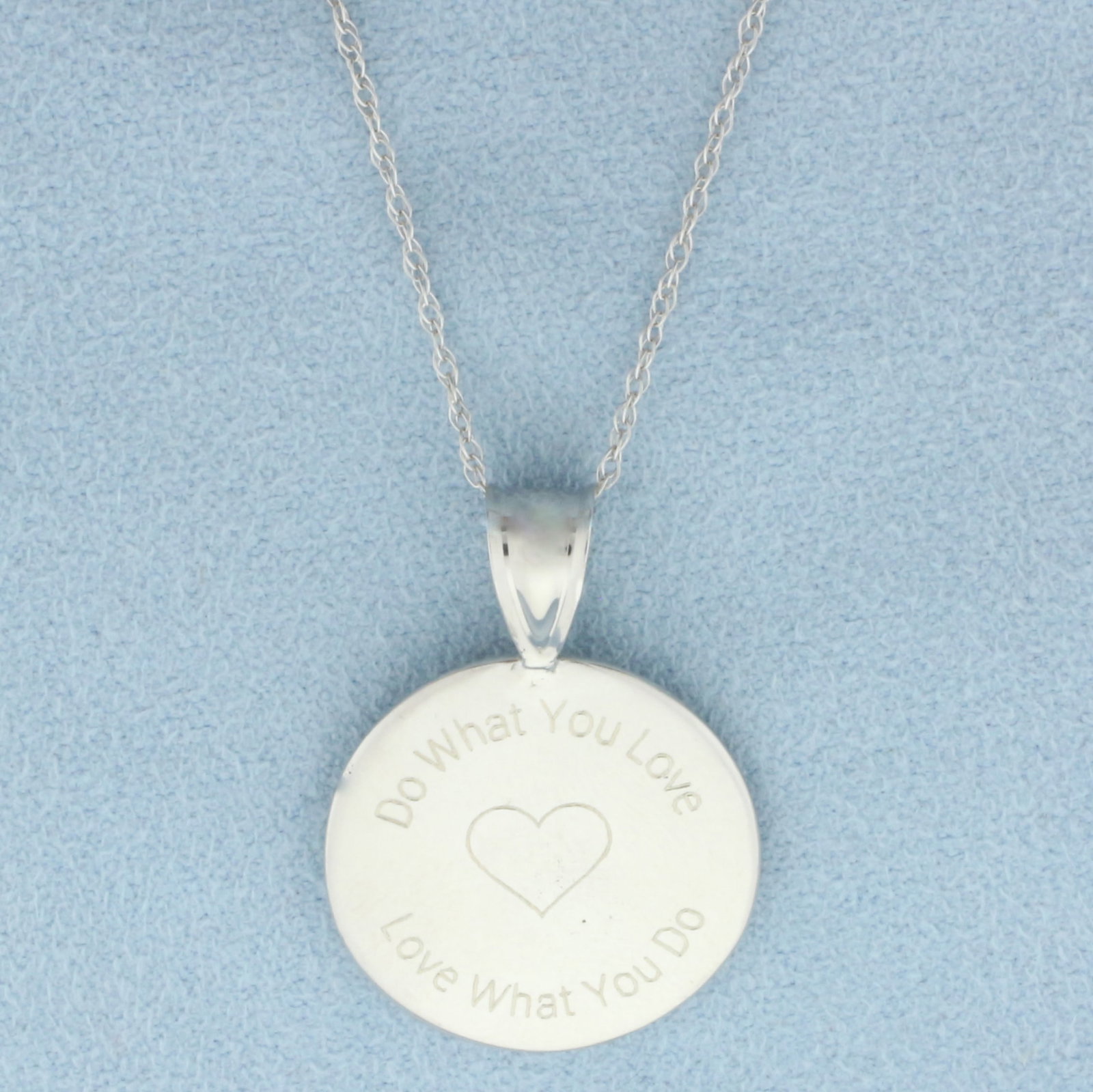 Do What You Love, Love What You Do Necklace in 14k White Gold: In 14k white gold. Chain is 18 inches long and .82mm thick. Spring clasp. Pendant is 1 1/16 inches long x 3/4 inches wide. 5.8g.