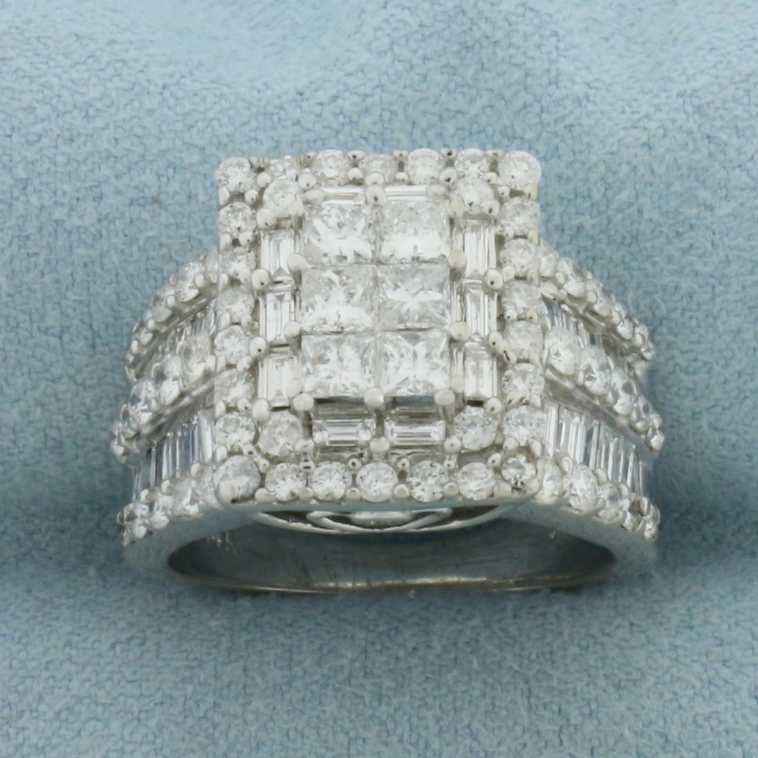 Baguette, Princess, and Round Diamond Ring in 14K White Gold: In 14k white gold. 15.1mm wide at top of ring. Contains six princess, thirty eight baguette, and fifty one round high quality diamonds, 4ct TW, SI clarity/G color. Size 6.75. 10.6g.