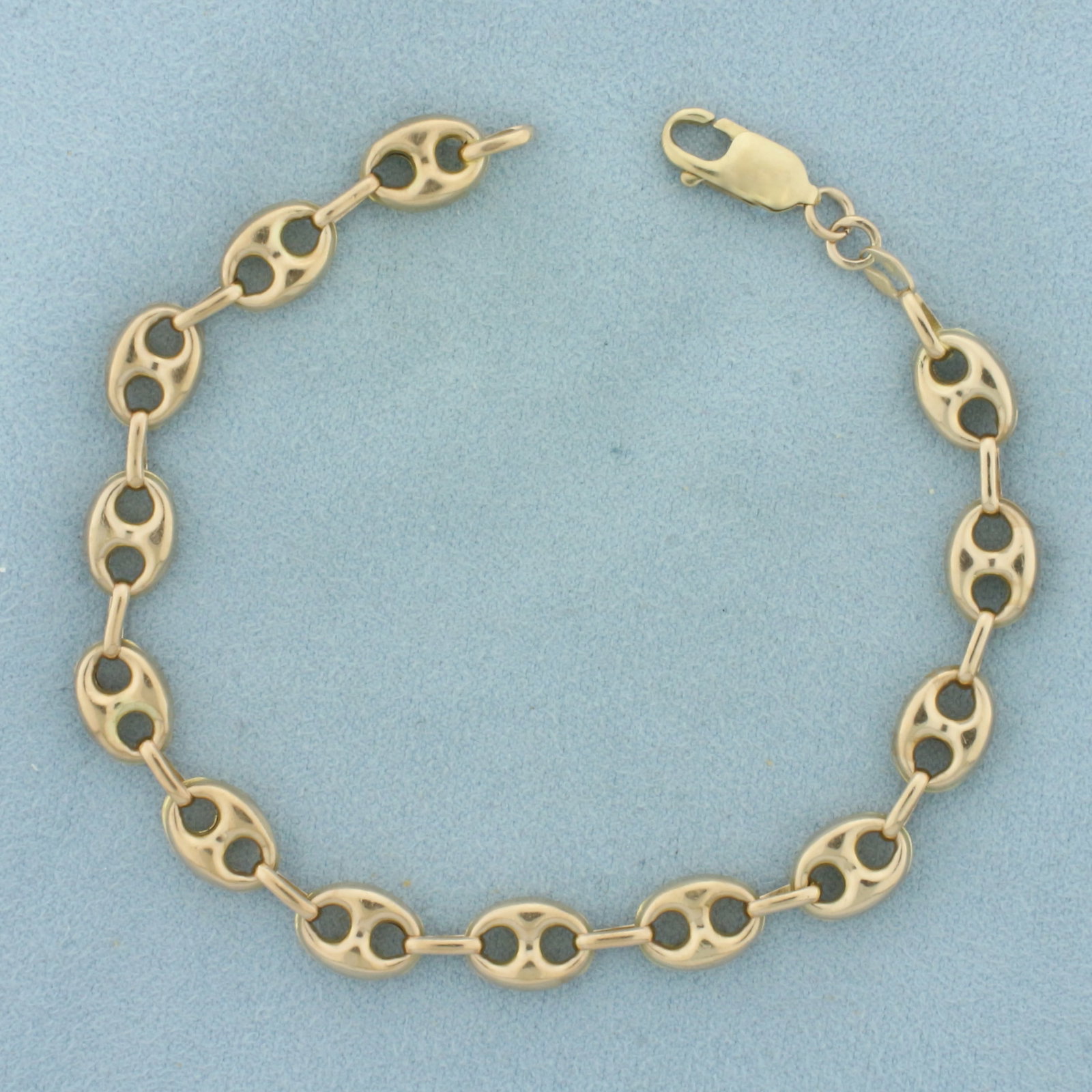 Puffy Anchor Mariner Link Bracelet in 14k Yellow Gold: In 14k yellow gold. 8 1/8 inch long by 1/4 inch wide. Lobster clasp. 7.9g.