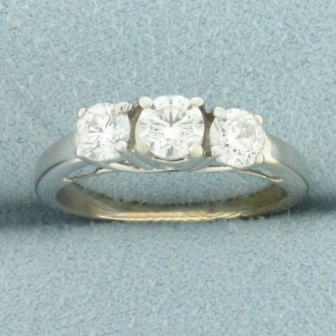 3-Stone Diamond Wedding Ring in 14k White Gold: In 14k yellow gold. Contains one .35ct and two .3ct high quality round brilliant diamonds, SI1 clarity/G color, great cut for lots of sparkle. Size: 6. 3.6g.