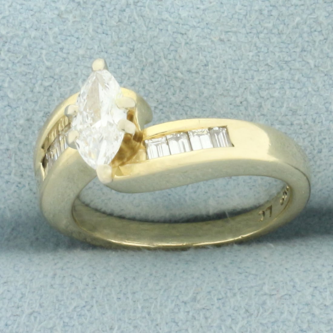 Marquise and Baguette Diamond Engagement Ring in 14k Yellow Gold: In 14k yellow gold. Center diamond is 1/2ct high quality marquise diamond, VVS clarity/G color, great cut for lots of sparkle. Also contains eight high quality baguette diamonds, 1/4ct TW, of similar 