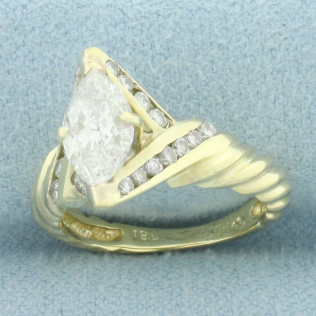 Marquise Diamond Rope Design Engagement Ring in 14k Yellow Gold: In 14k yellow gold. Contains one high quality 1.1ct Marquise diamond, I color/I clarity, eye clean, great cut for lots of sparkle. Also contains twenty-two high quality .01ct diamonds, I color/SI clar