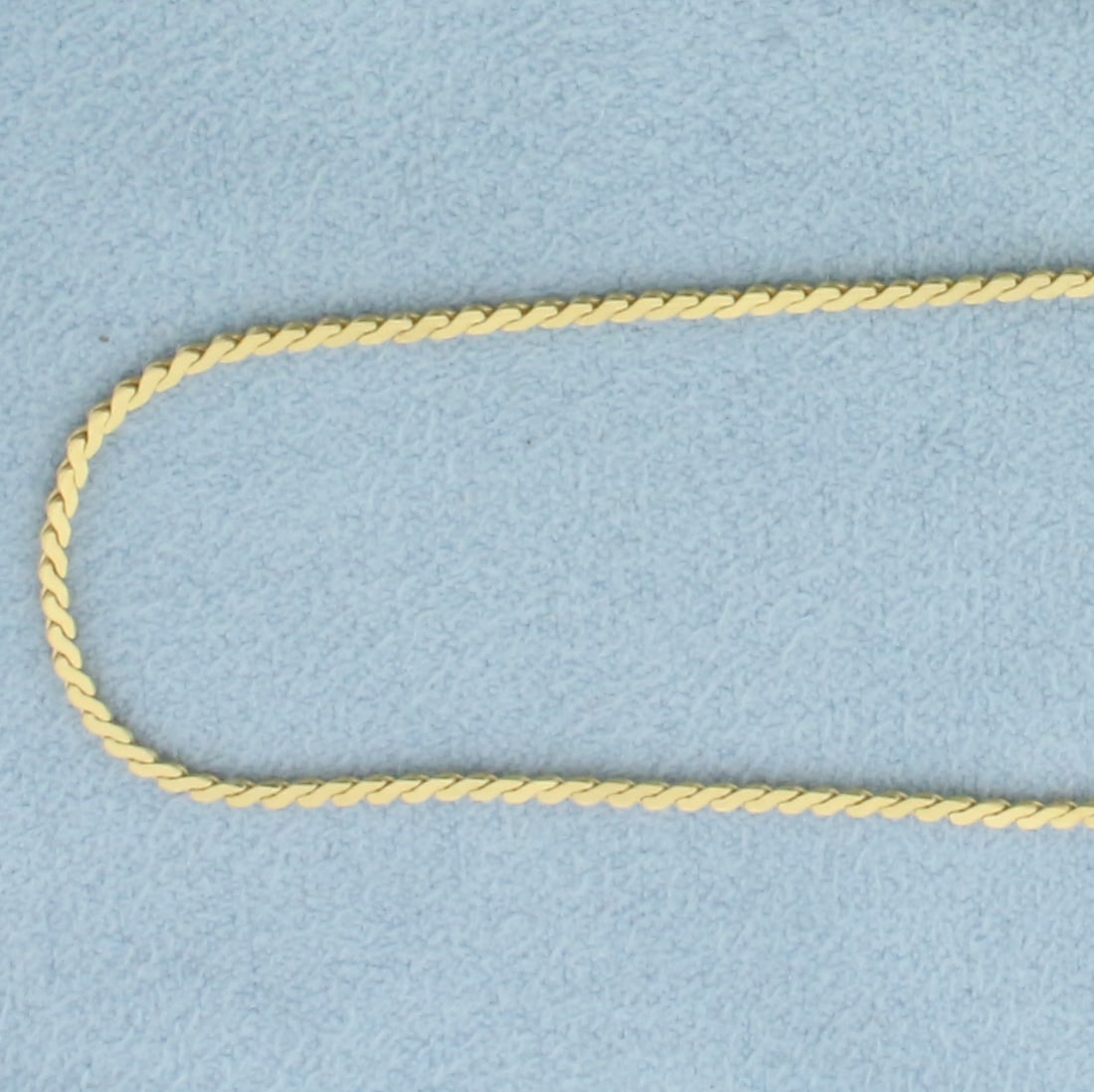Italian 24 Inch S-Link Chain in 18k Yellow Gold: In 18k Yellow Gold. 24 inch long. 1.3mm wide. Italian. Spring clasp. 5.6g.