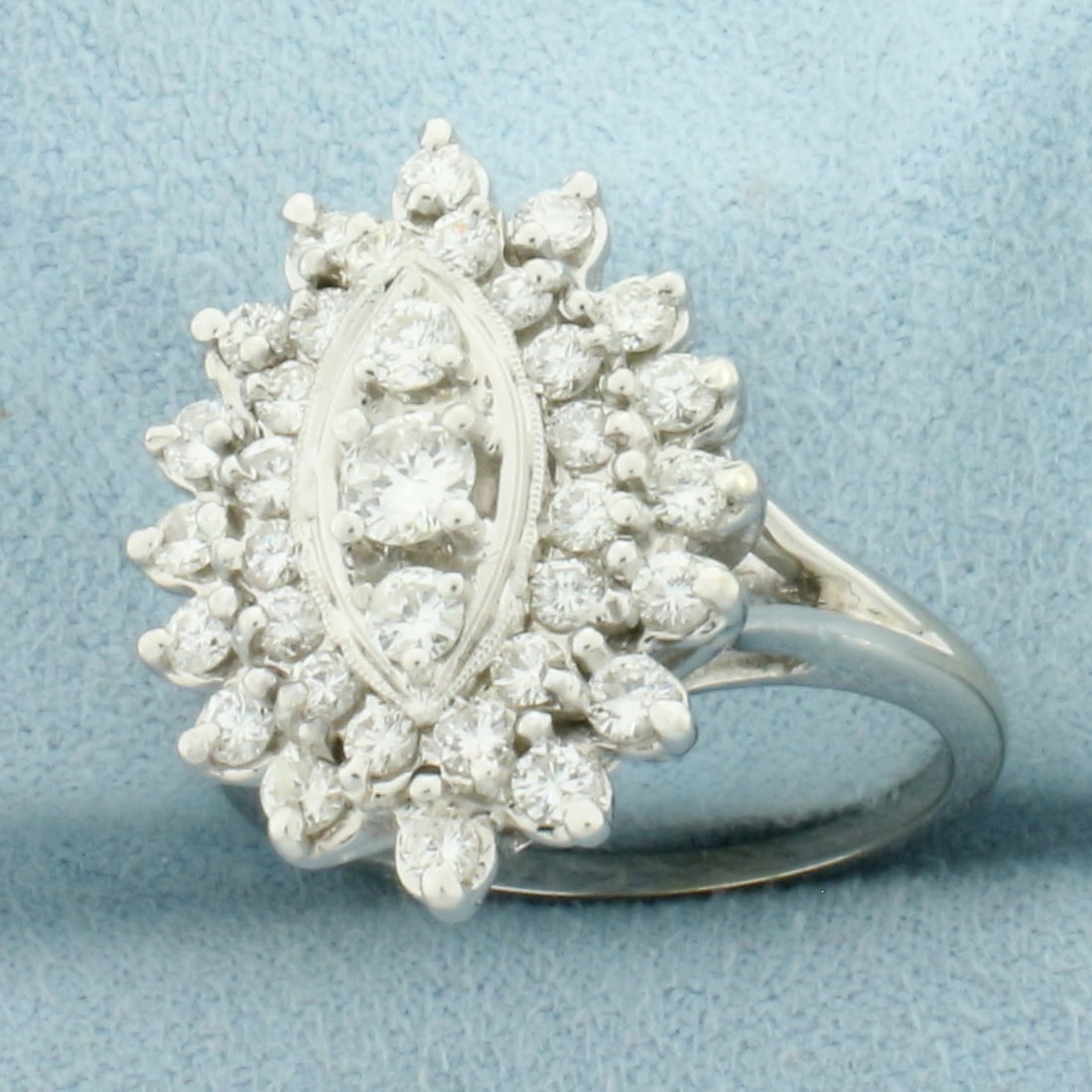 Vintage Diamond Cocktail Ring in 14k White Gold: In 14k White Gold. Contains 35 high quality diamonds ranging from .03ct to .2ct each, 1.5ct TW, G color/SI clarity . 22mm wide at center. Size 9. 8.3g.