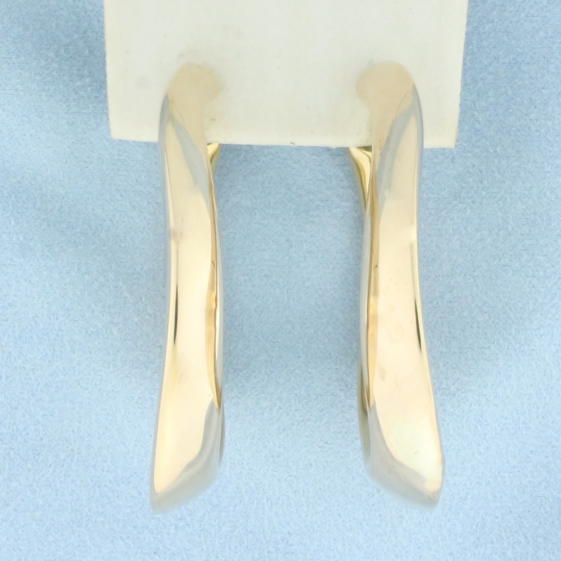 Large Italian Hoop Earrings in 14k Yellow Gold: In 14k Yellow Gold. 2 inches long. 1 5/8 inch wide. 7.54mm thick. Leverbacks. 10.6g.