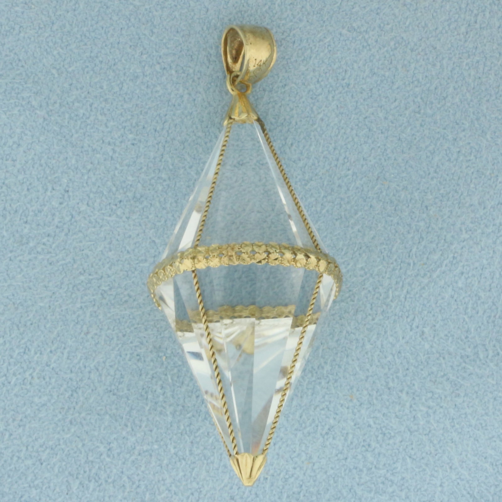 Quartz Energy Amplifier Pendant in 14K Yellow Gold: In 14k yellow gold. 2 inches long by 5/8 inch wide. Contains high quality faceted quartz gemstone for energy amplifying and healing. 11.3g.