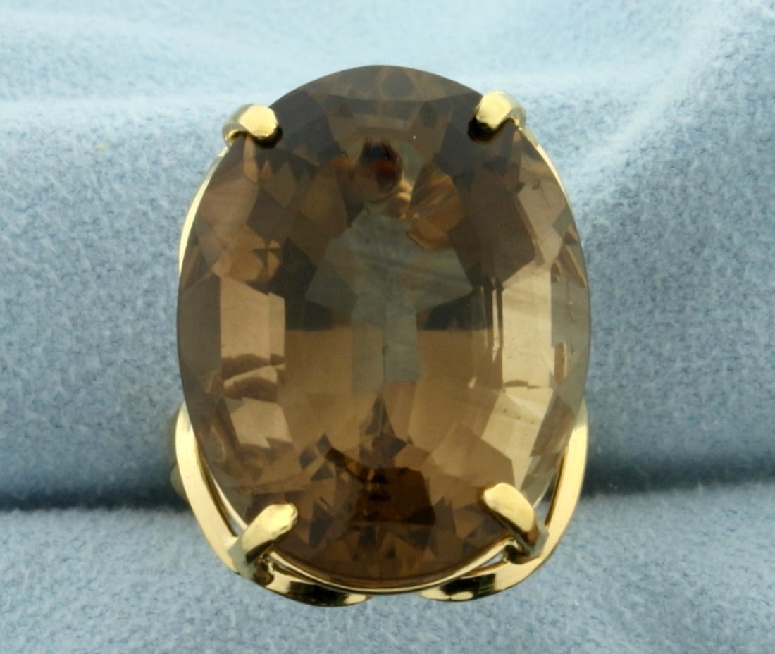 40ct Smokey Topaz Statement Ring in 18k Yellow Gold: In 18k yellow gold. Contains a high quality 40ct Natural Smokey Topaz Gemstone with a warm champagne color and excellent clarity. Size 7 1/2. 11.3g.