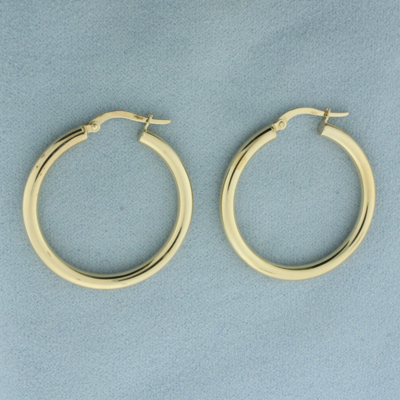 Italian Hoop Earrings in 14K Yellow Gold: In 14k yellow gold. Italian made. 1 1/4 inch diameter, 3mm thick tubes, with leverbacks. 2.8g.