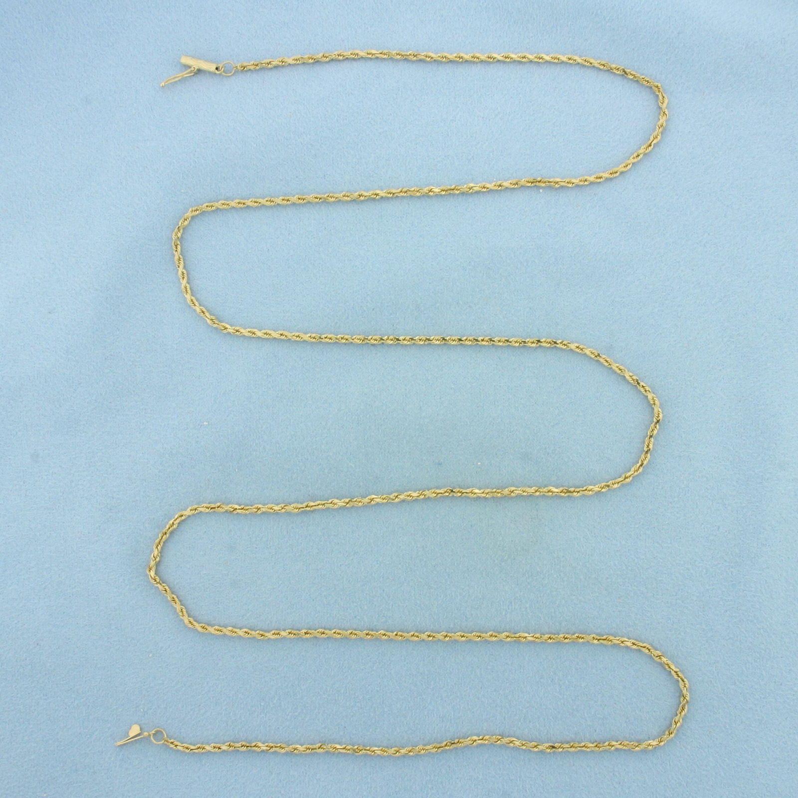 30 Inch Rope Link Chain Necklace in 14K Yellow Gold: In 14k yellow gold. 30 inches long and 1.75mm wide. Barrel clasp with safety latch. 10.6g.