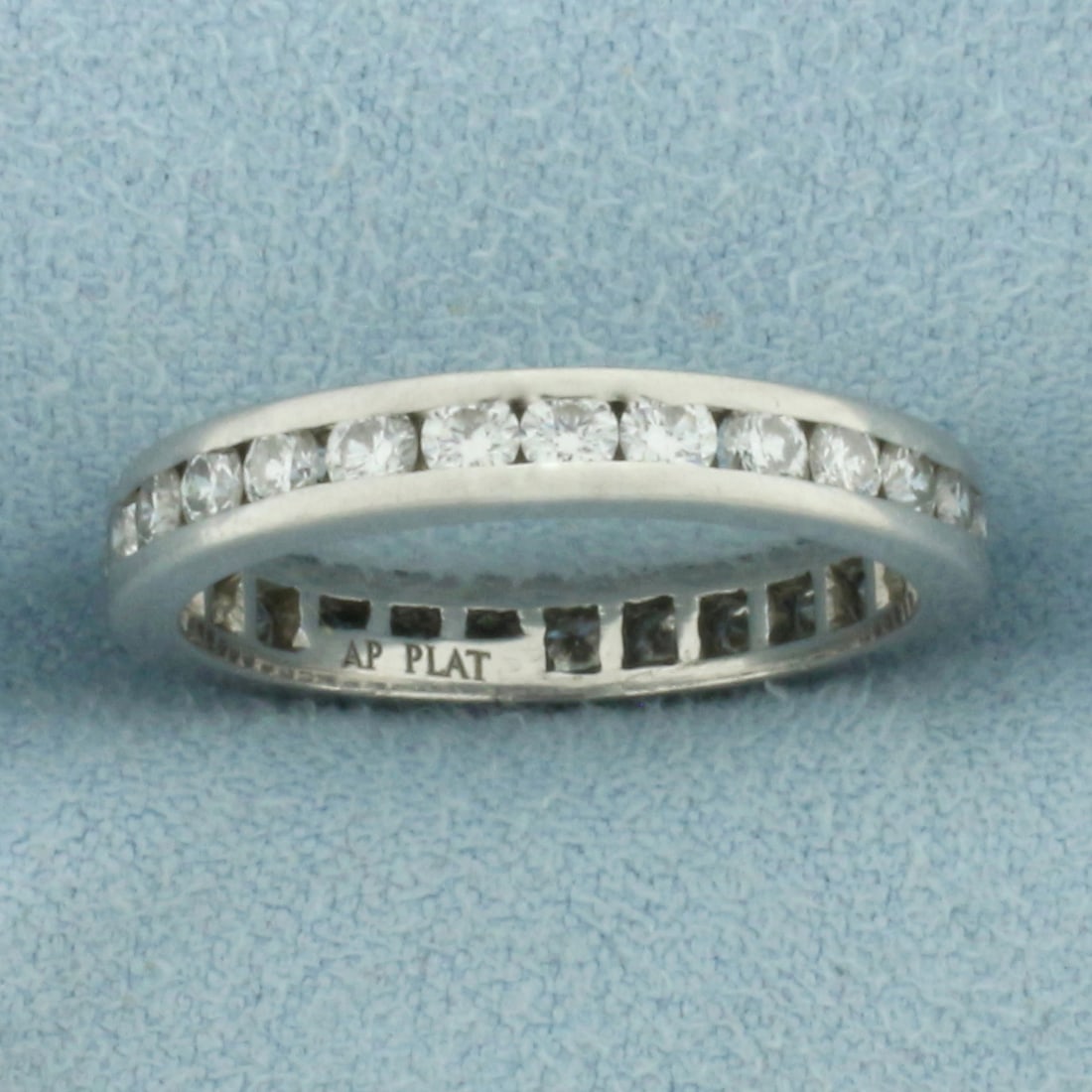 Diamond Eternity Band Ring in Platinum: In platinum. 3.3mm wide. Contains twenty seven .05ct high quality natural diamonds, 1.35ct TW, SI clarity/G color. Size 6.5. 3.8g.