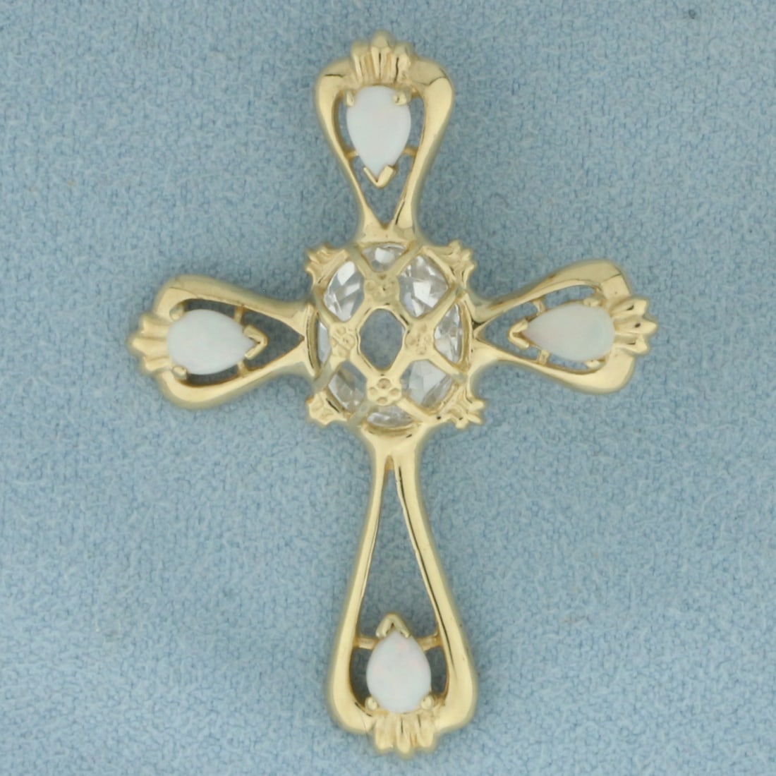 Topaz and Opal Cross Pendant in 14k Yellow Gold: In 14k yellow gold. 1 1/2 inch long by 1 inch wide. Contains 1 high quality 10x8mm White Topaz gemstone. Accented with 4 high quality 5x3.5mm pear cabochon Opal gemstones with excellent play of color,