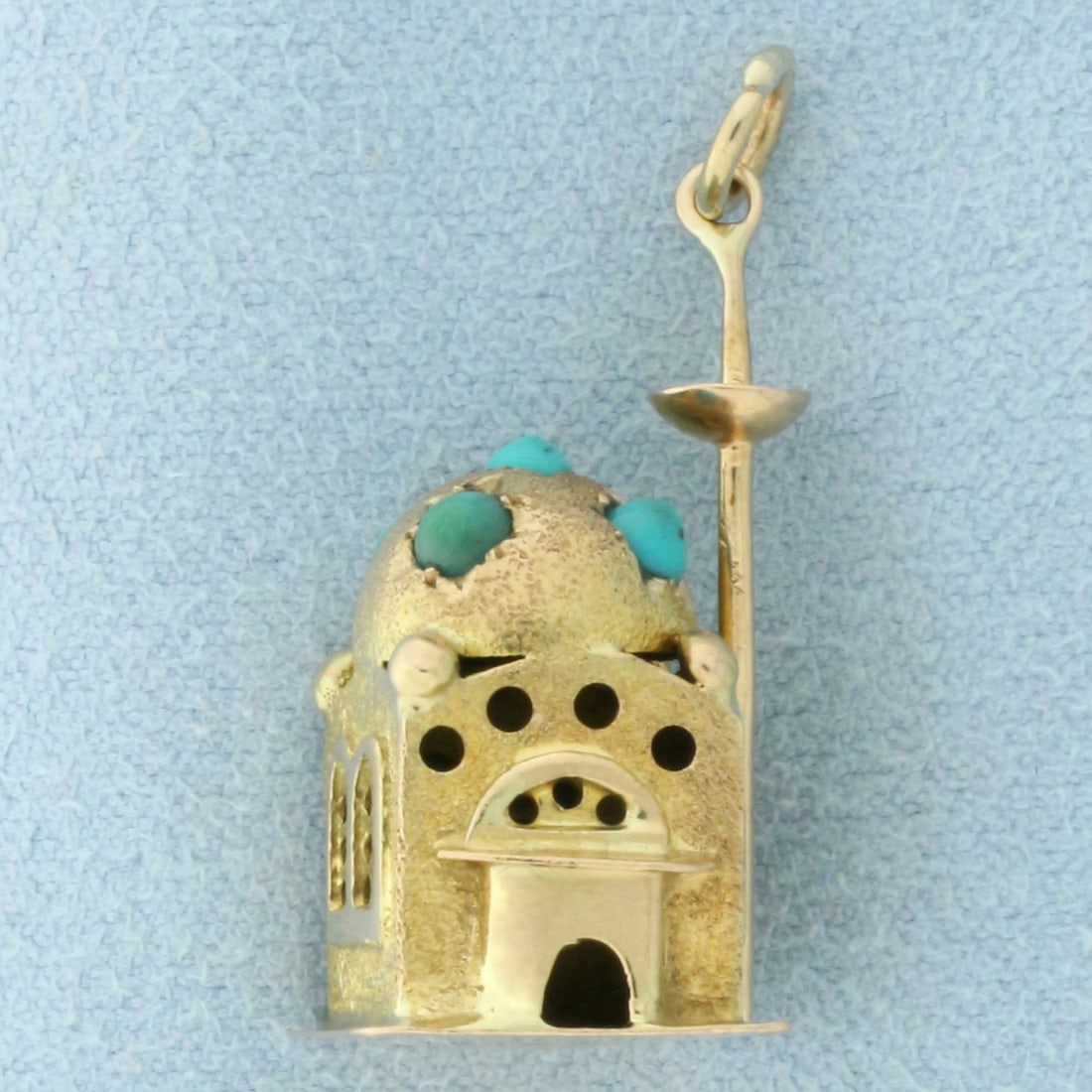 Turquoise Mosque Charm in 14k Yellow Gold: In 14k yellow gold. Contains five high quality natural 2.5mm Turquoise gemstones with beautiful baby blue color. 1 inch long and 1/2 inches wide. 3.9g.