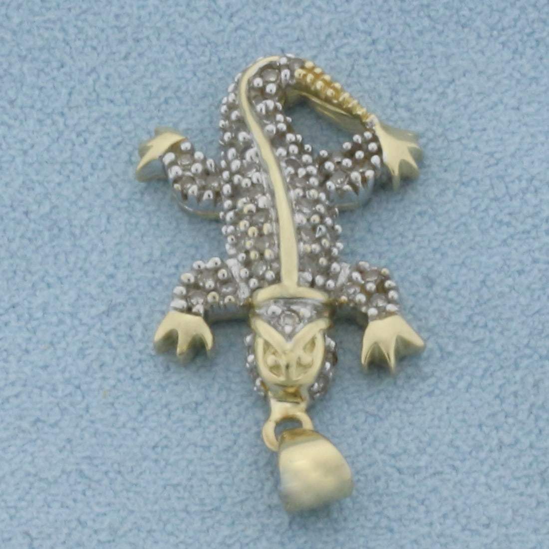 Diamond Lizard Gecko Pendant in 10K Yellow Gold: 1 inch long (including bail) by 1/2 inch wide. Contains 47 high quality natural 1/2pt diamonds. 2.7g.