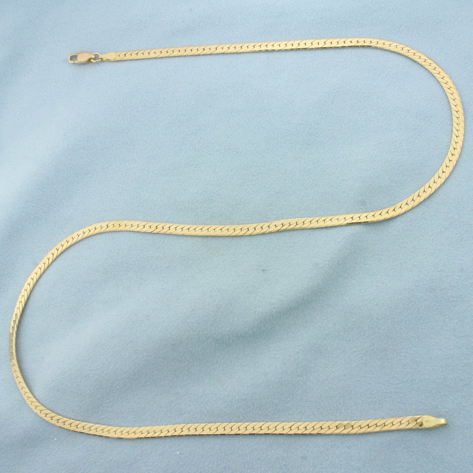 20 Inch Herringbone Link Chain Necklace in 14K Yellow Gold: In 14k yellow gold. 20 inches long by 3.6mm wide with lobster clasp. 14.4g.