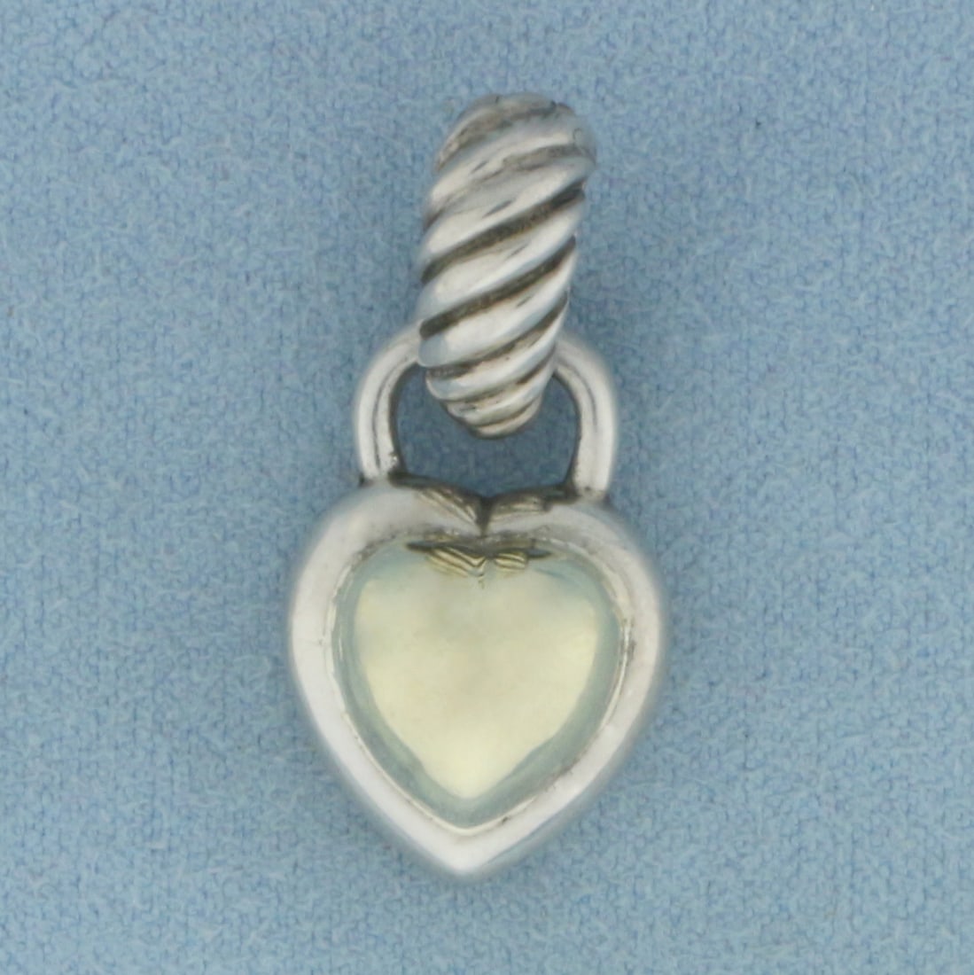 David Yurman Two Tone Cable Heart Pendant Enhancer in Sterling Silver and 14K Yellow Gold: In .925 sterling silver and 14k yellow gold. 1 inch long (including bail) by 1/2 inch wide with hinged bail for easy attachment. 5.8g.