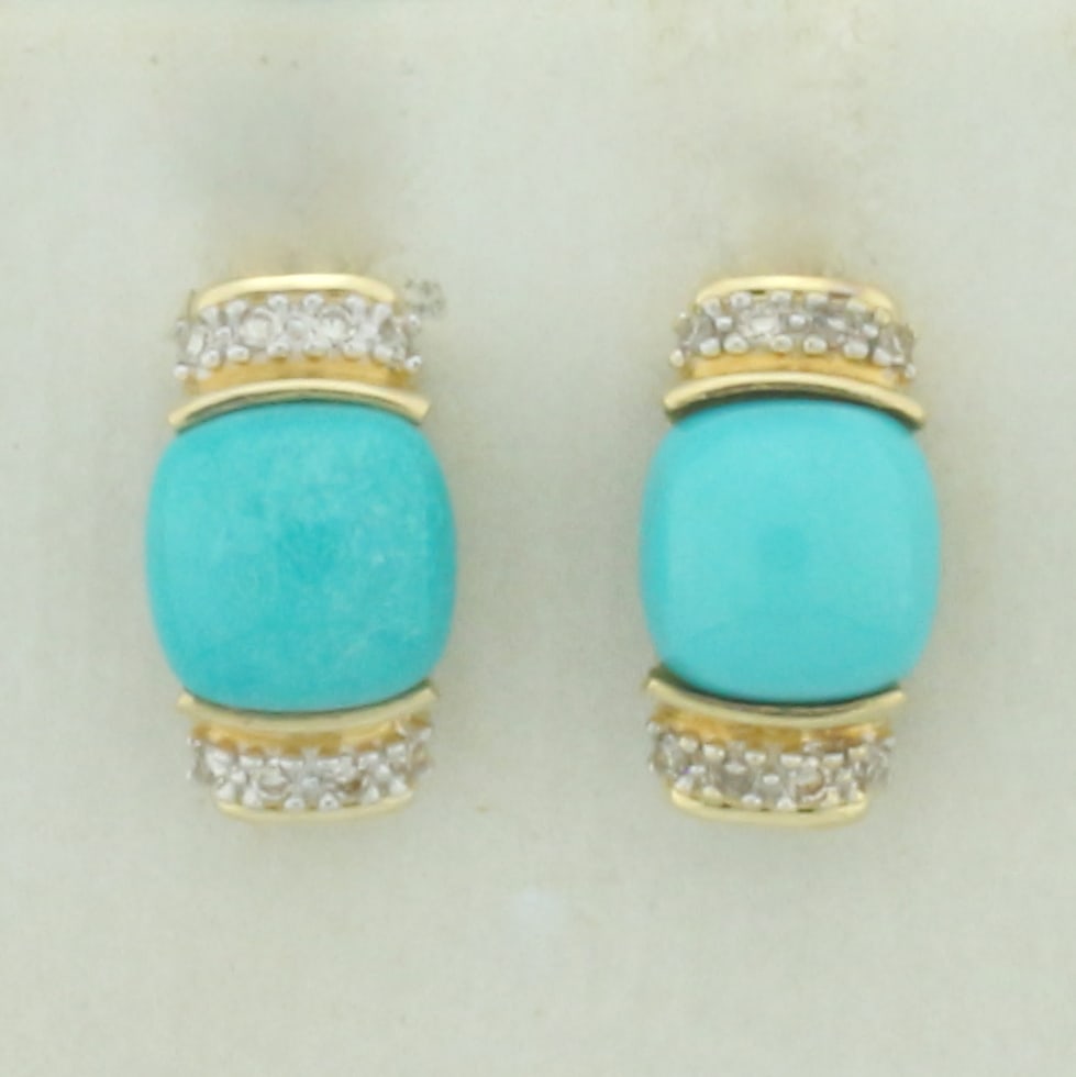 Persian Turquoise and Diamond Earrings in 14K Yellow Gold: In 14k yellow gold. Contains two 6mm Persian Turquoise gemstones with vibrant blue color. Also contains eight high quality 1/2pt natural diamonds. 3/8 inch long by 1/8 inch wide (profile). Friction ba