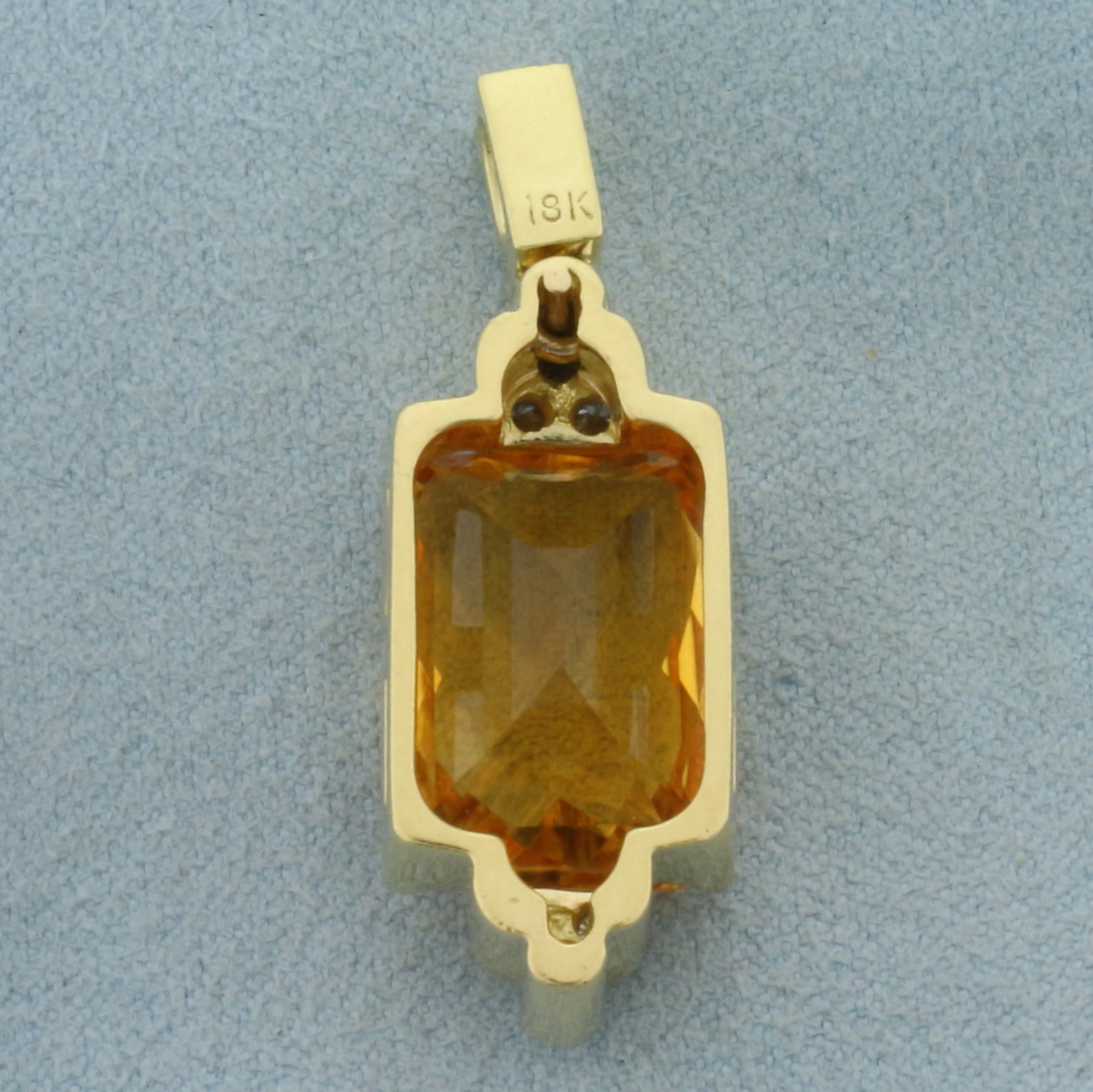 Checkerboard Cut Citrine and Diamond Pendant in 18k Yellow Gold: In 18k Yellow Gold. Contains one 12x16.5mm high quality fancy checkerboard cut natural Citrine gemstone with intense color and excellent clarity. Also contains one .15ct emerald cut and six .05ct roun