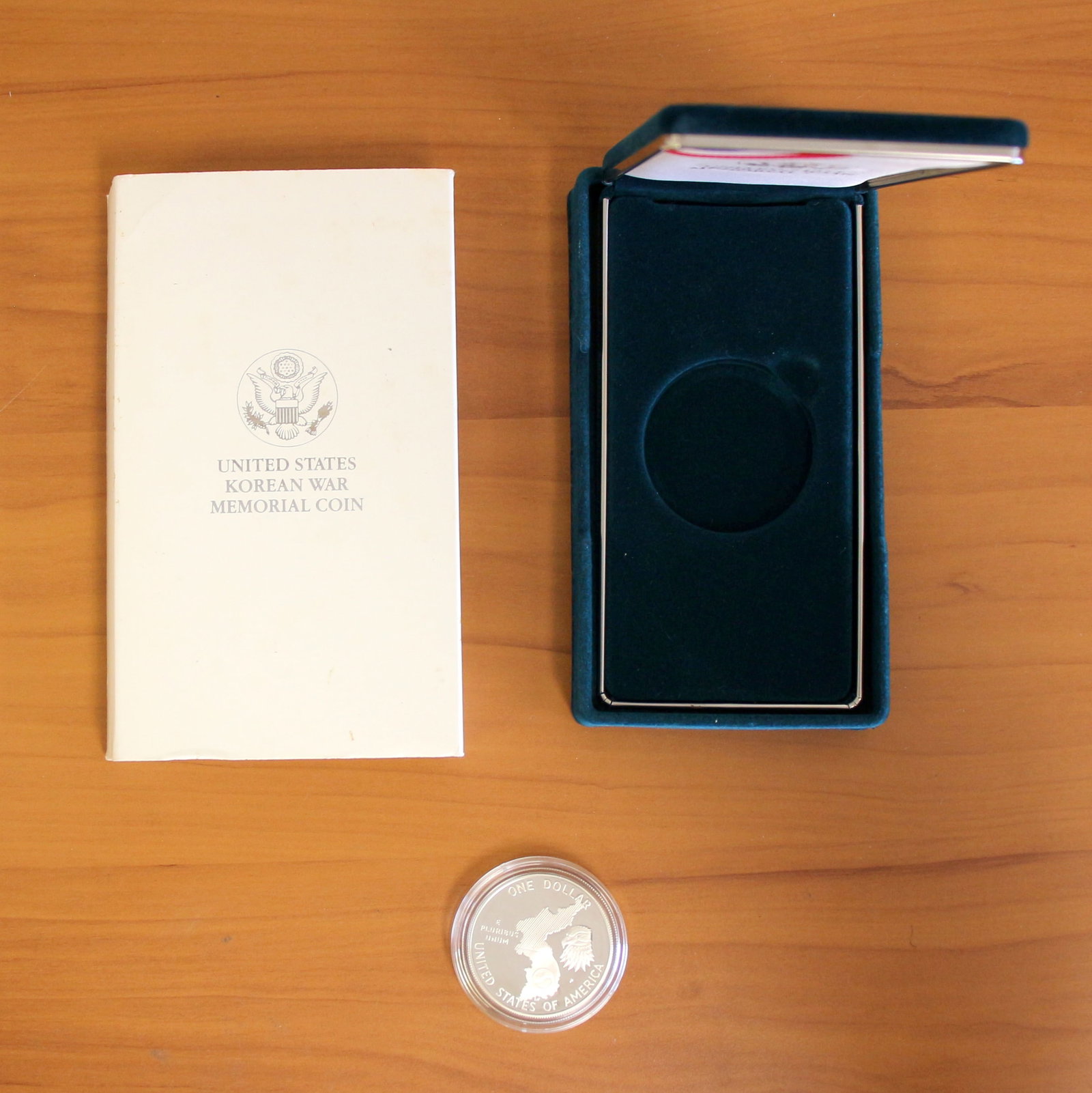US Mint 38th Anniversary Korean War Memorial Silver Coin OGP: Contains one 38th Anniversary Korean War $1 Silver Memorial Coin. Includes original packaging.