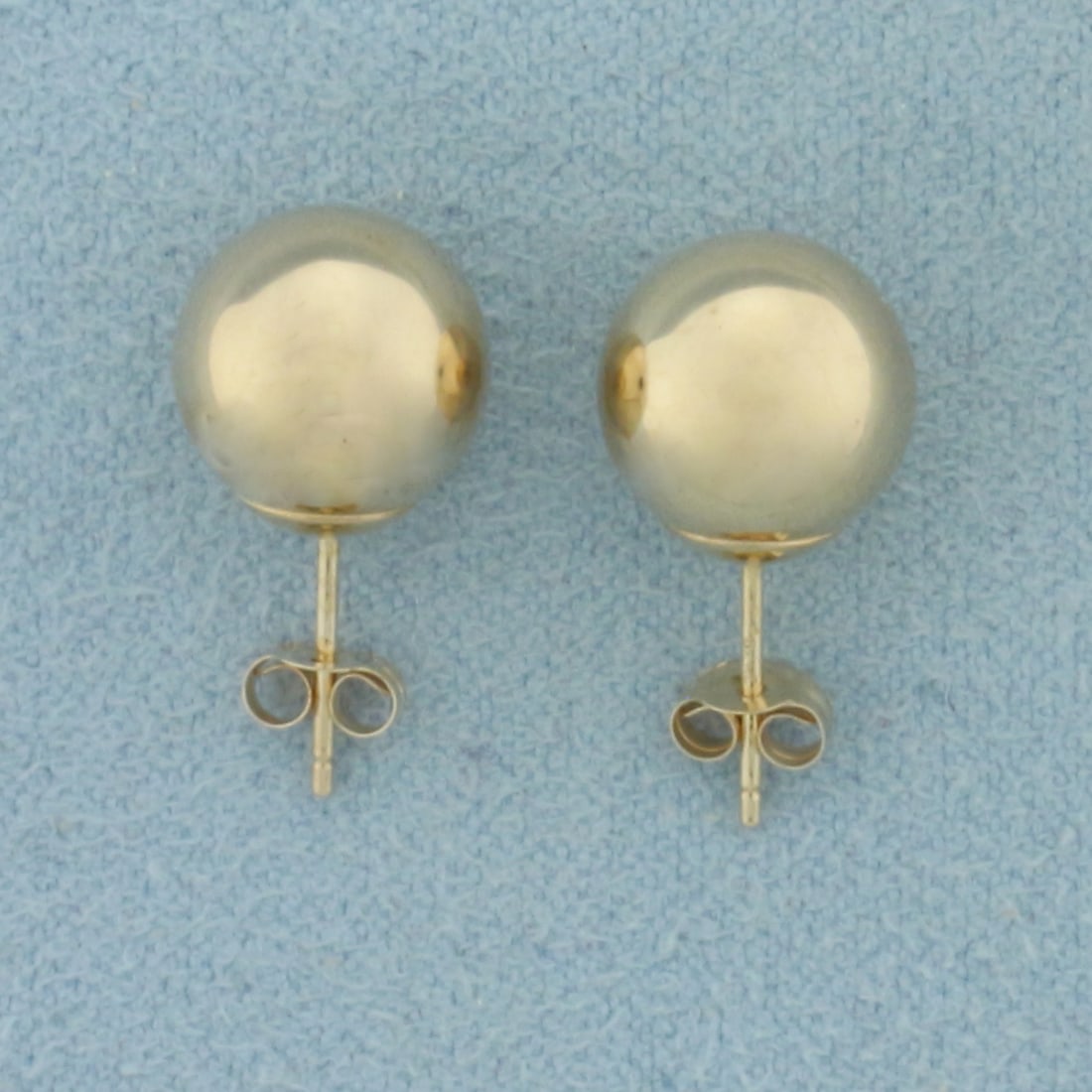 9MM Ball Bead Stud Earrings in 10K Yellow Gold: In 10k yellow gold. 9mm diameter. Friction backs. .8g.