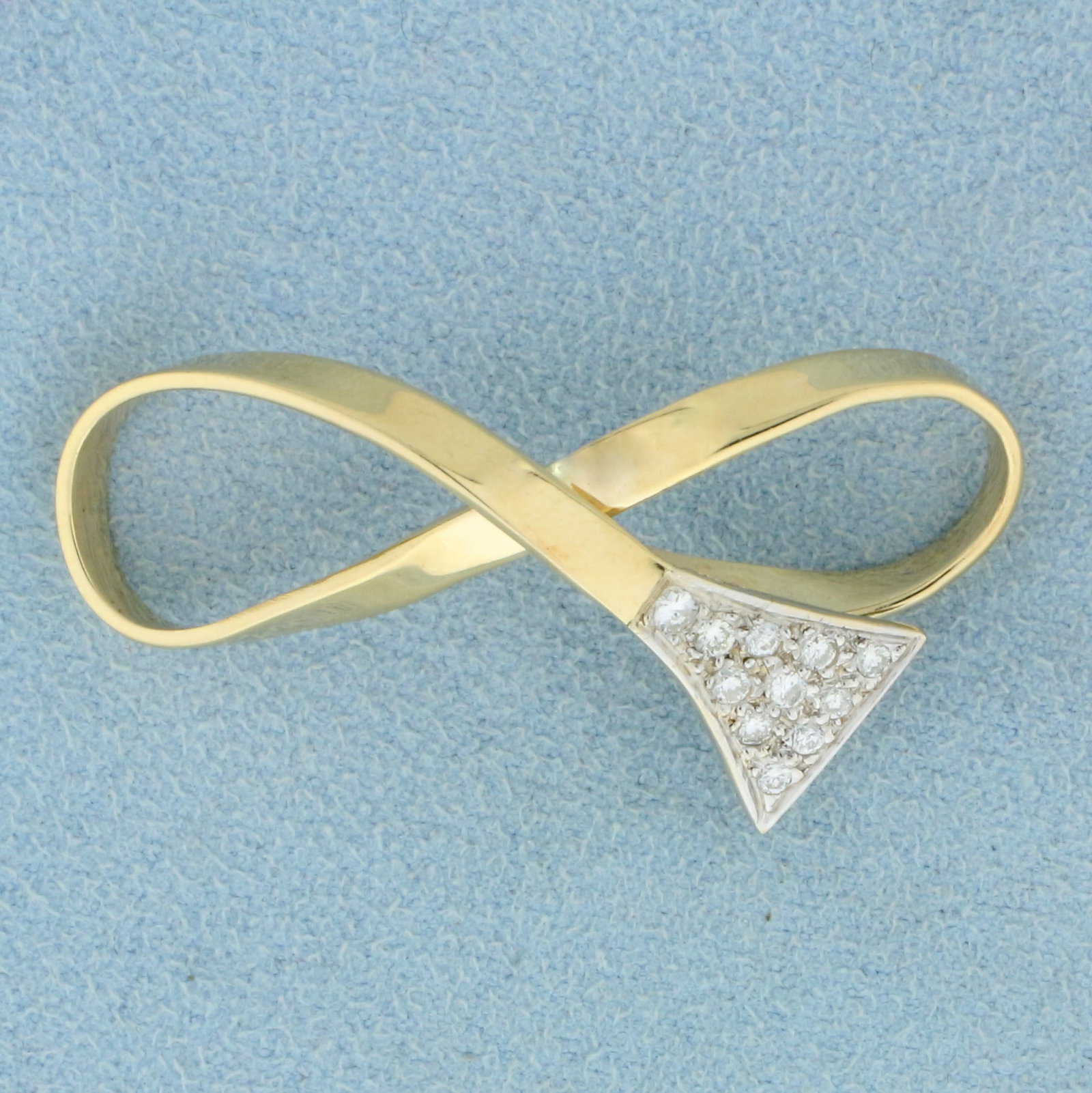Diamond Infinity Slide or Pendant in 14K Yellow Gold: In 14K Yellow Gold. Contains eleven high quality diamonds, 1/3ct TW, SI clarity/G color. 1 3/4 inches long, 1/2 inch wide. 4.9g.