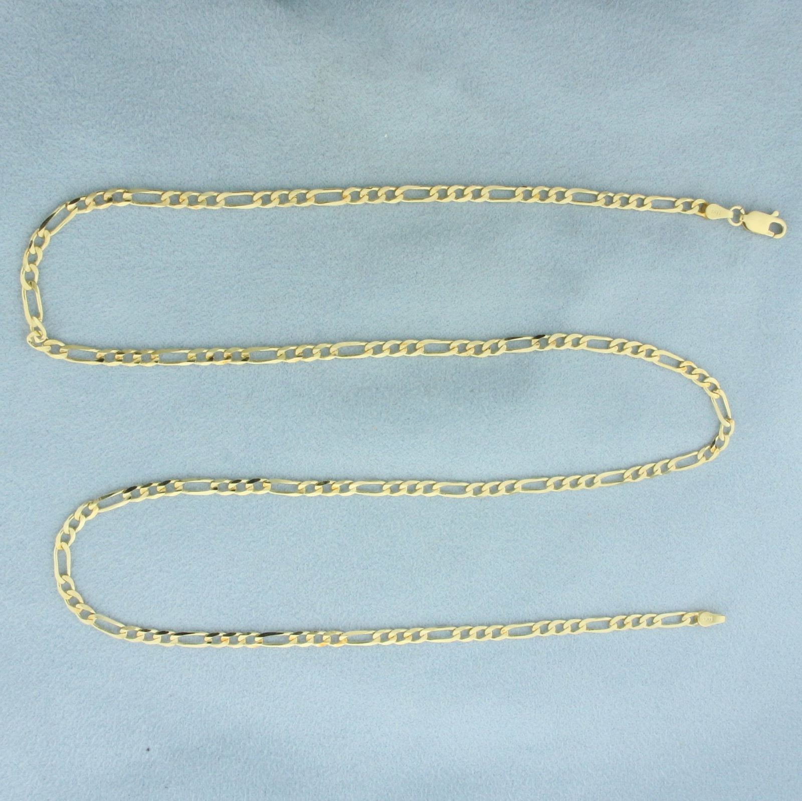 22 Inch Figaro Link Chain Necklace in 14K Yellow Gold: In 14k yellow gold. 22 inches long by 3mm wide with lobster clasp. 8.5g.