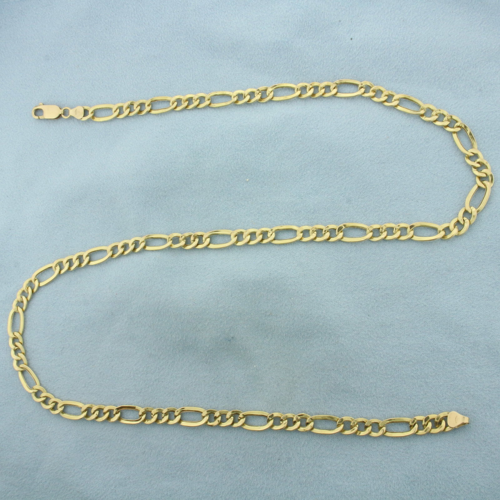 21 Inch Italian Figaro Link Chain Necklace in 10K Yellow Gold: In 10k yellow gold. 21 inches long by 6.3mm wide with lobster clasp. 9.4g.