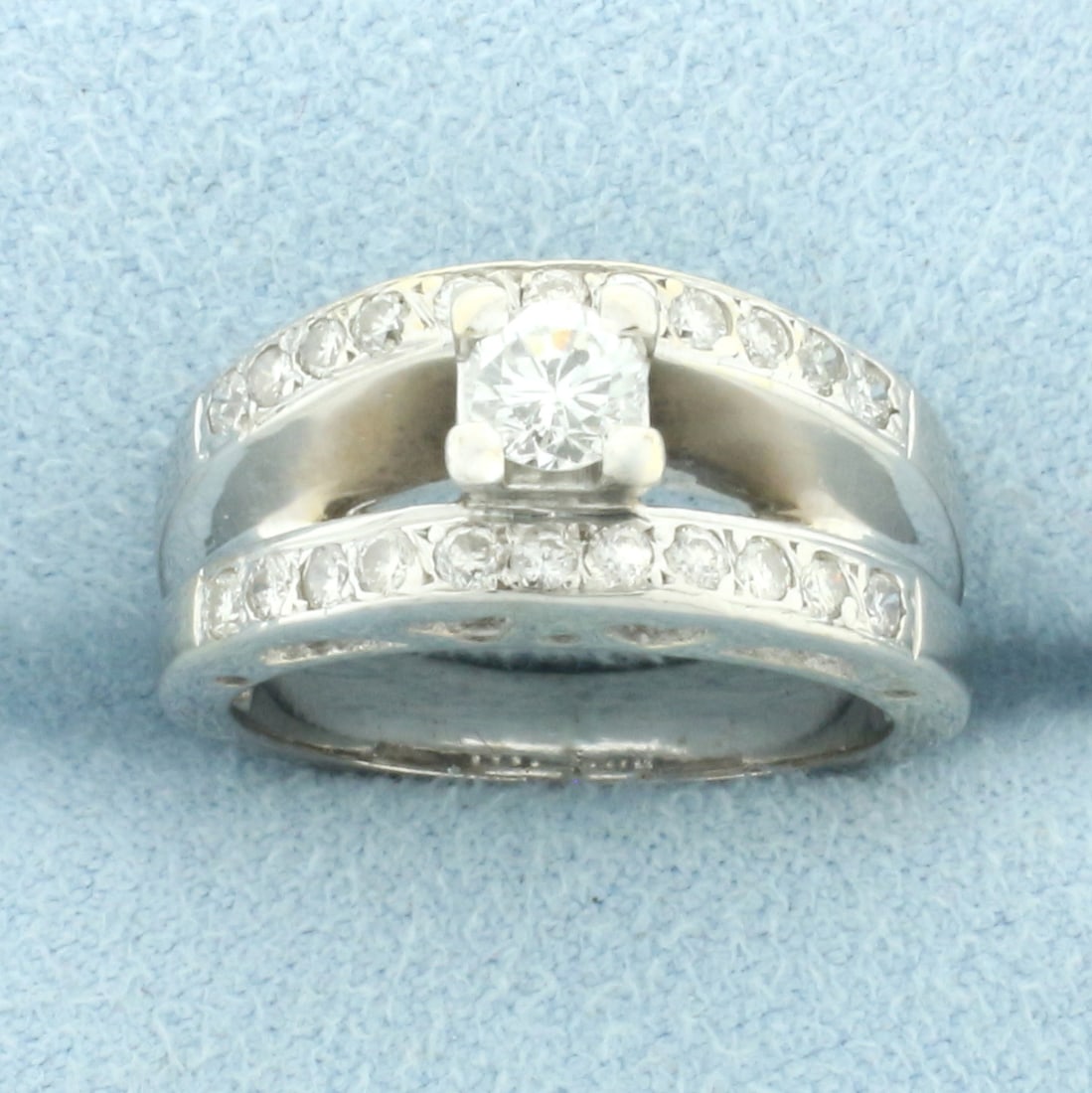 Diamond Engagement Ring with Cutout Hearts in 18k White Gold: In 18k white gold. Center diamond is high quality 1/4ct Round Brilliant, H color/I1 clarity, great cut for lots of sparkle. Accent diamonds are 1/4ct TW of similar high quality. Heart Design cut outs 