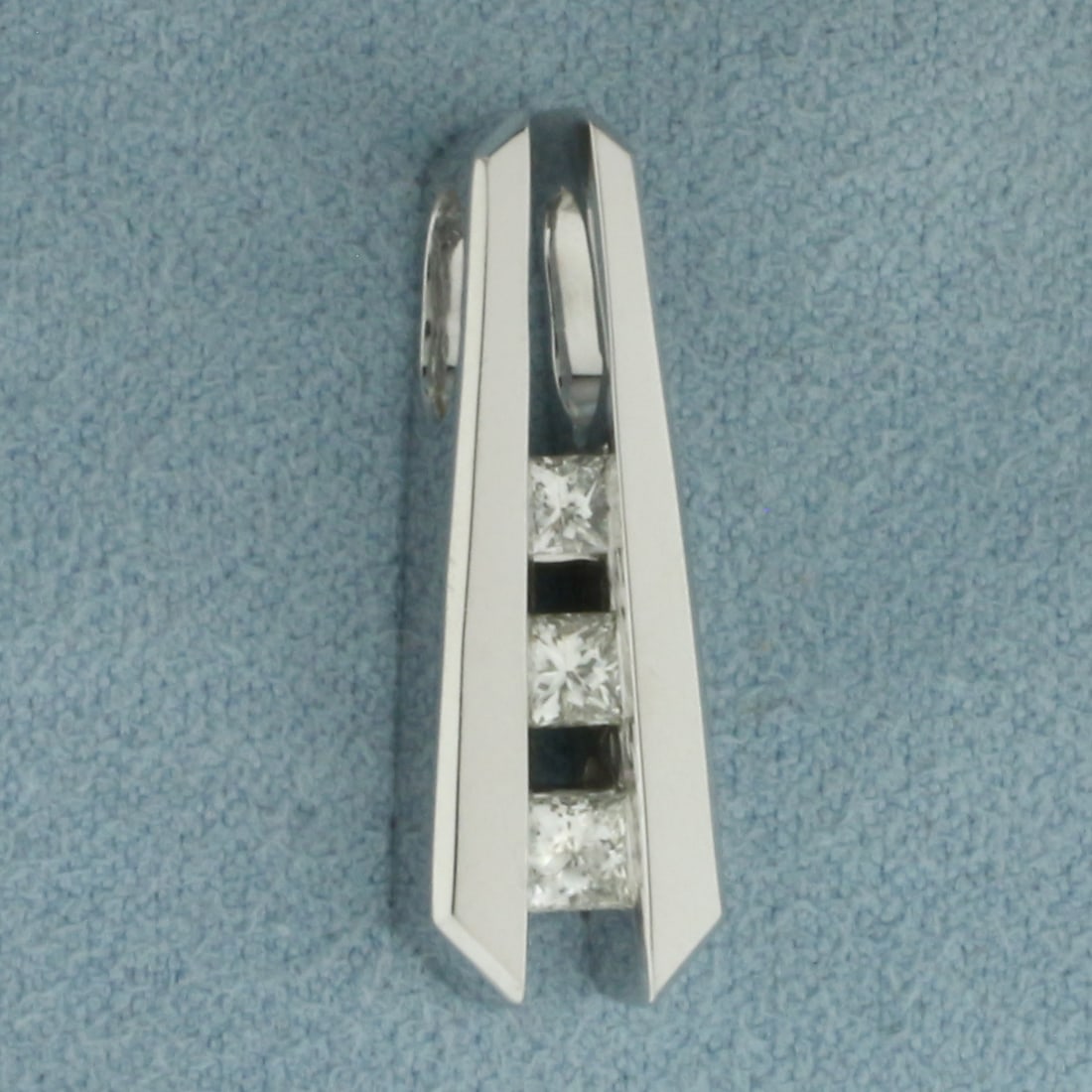 3 Stone Past Present Future Diamond Pendant in 14K White Gold: In 14k white gold. 1 inch long by 8.5mm wide. Contains 3 high quality natural princess cut Diamonds, 1/2ct TW,SI clarity/H color. 6.9g.