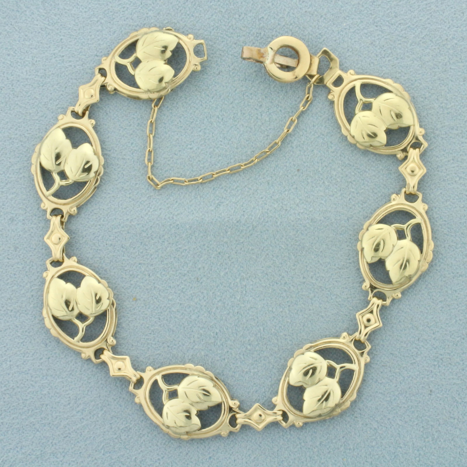 Leaf Design Nature Bracelet in 14k Yellow Gold: In 14k yellow gold. 7 inches long and 12mm wide. Safety chain. 6.7g.