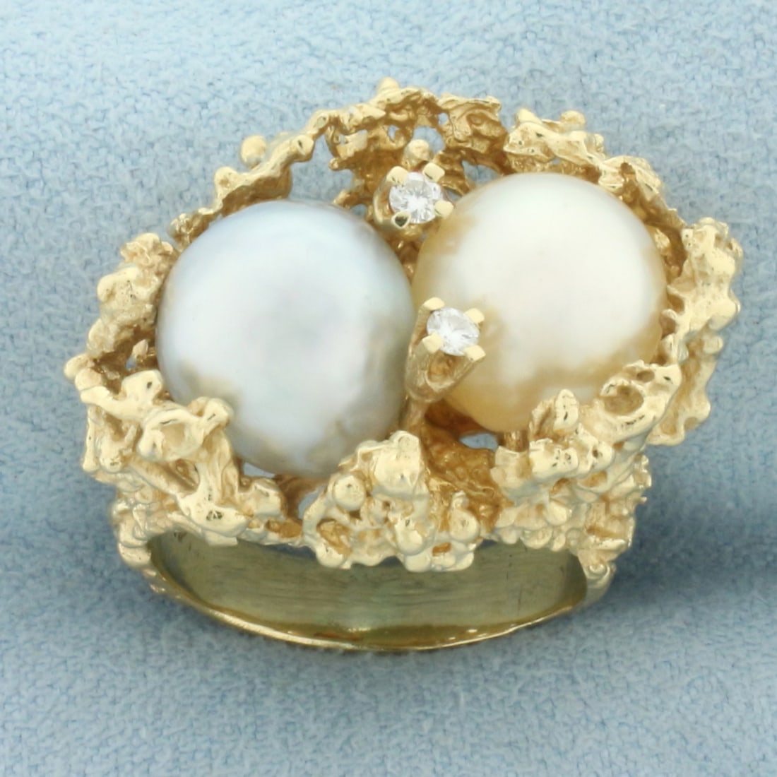 South Sea Pearl, Tahitian Pearl, and Diamond Nest Ring in 14k Yellow Gold: In 14k yellow gold. Contains one 10mm high quality Tahitian Pearl with high luster and beautiful golden color. Also contains one high quality 11mm high quality Tahitian pearl with high luster and beau