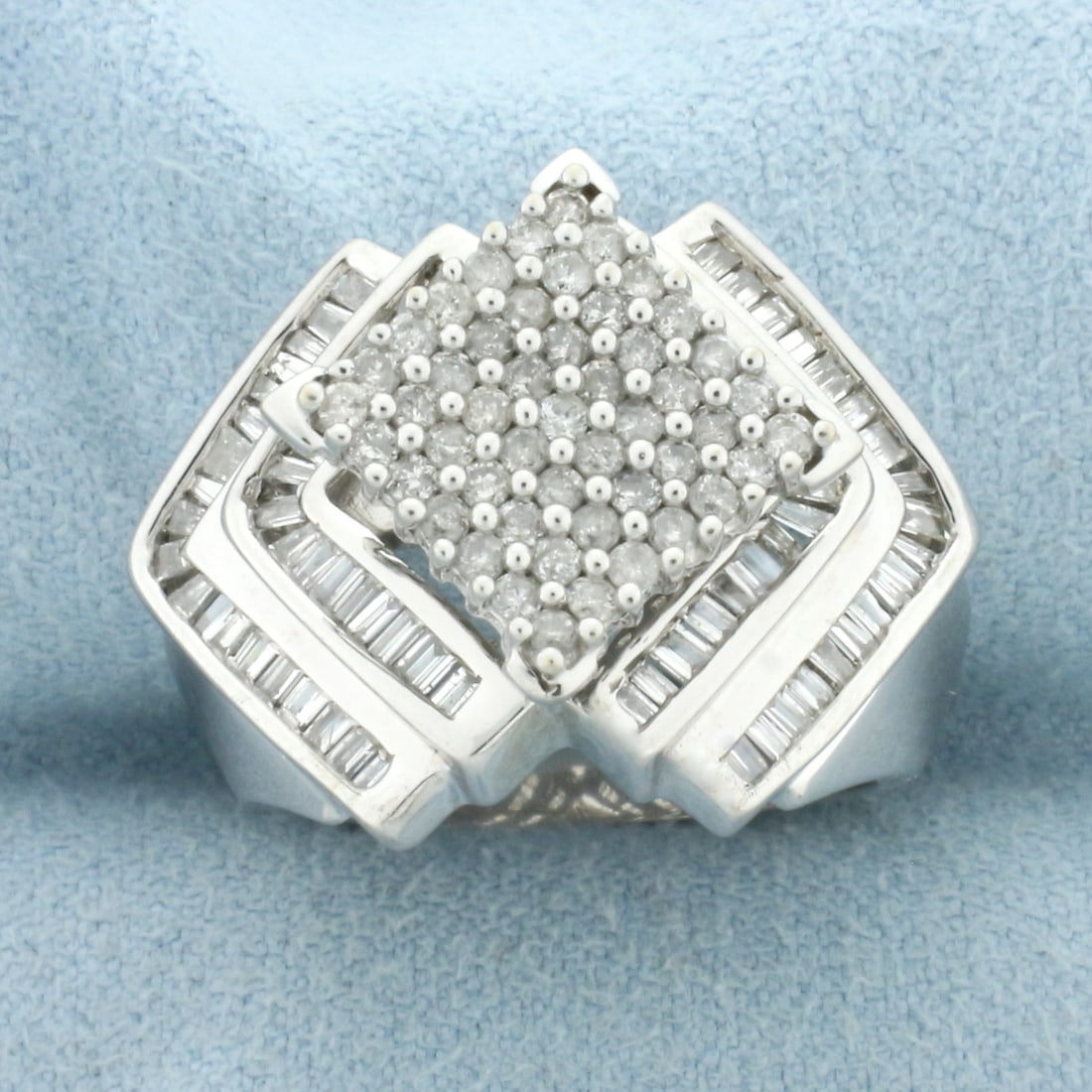 Round and Baguette Diamond Statement Ring in 14k White Gold: In 14k White Gold. Contains forty-nine round and seventy-eight baguette high quality diamonds, 1.5ct TW, SI clarity/H color. 18.4mm wide at the widest point. Size 6.5. 8.2g.