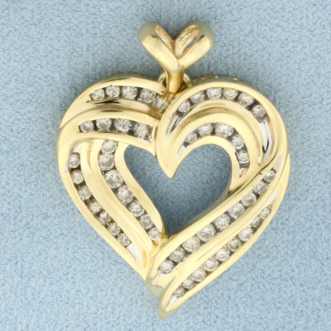 Large Diamond Heart Pendant in 14k Yellow Gold: In 14k Yellow Gold. Contains fifty-one high quality diamonds, 1/2ct TW, SI clarity;/I color. 1 3/8 inch long including bale. 1 inch wide. 6.8g.