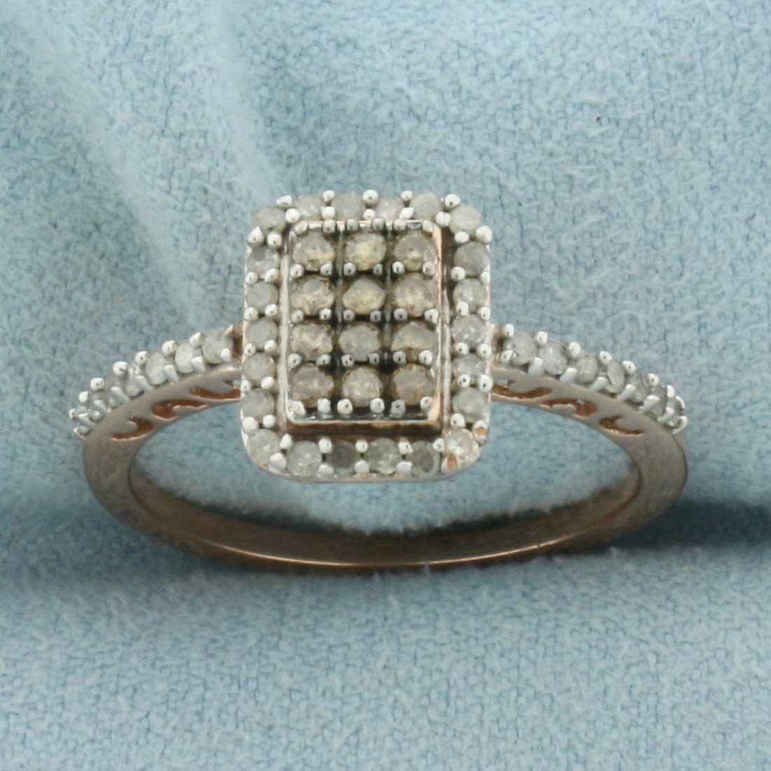 Chocolate and White Diamond Halo Ring in 10K Rose Gold: In 10k rose gold.10.3mm wide at top of ring. Contains 12 high quality .02ct chocolate Diamonds with warm color. Also contains thirty-six .01ct high quality "white" diamonds. Size 8.25. 3.0g.