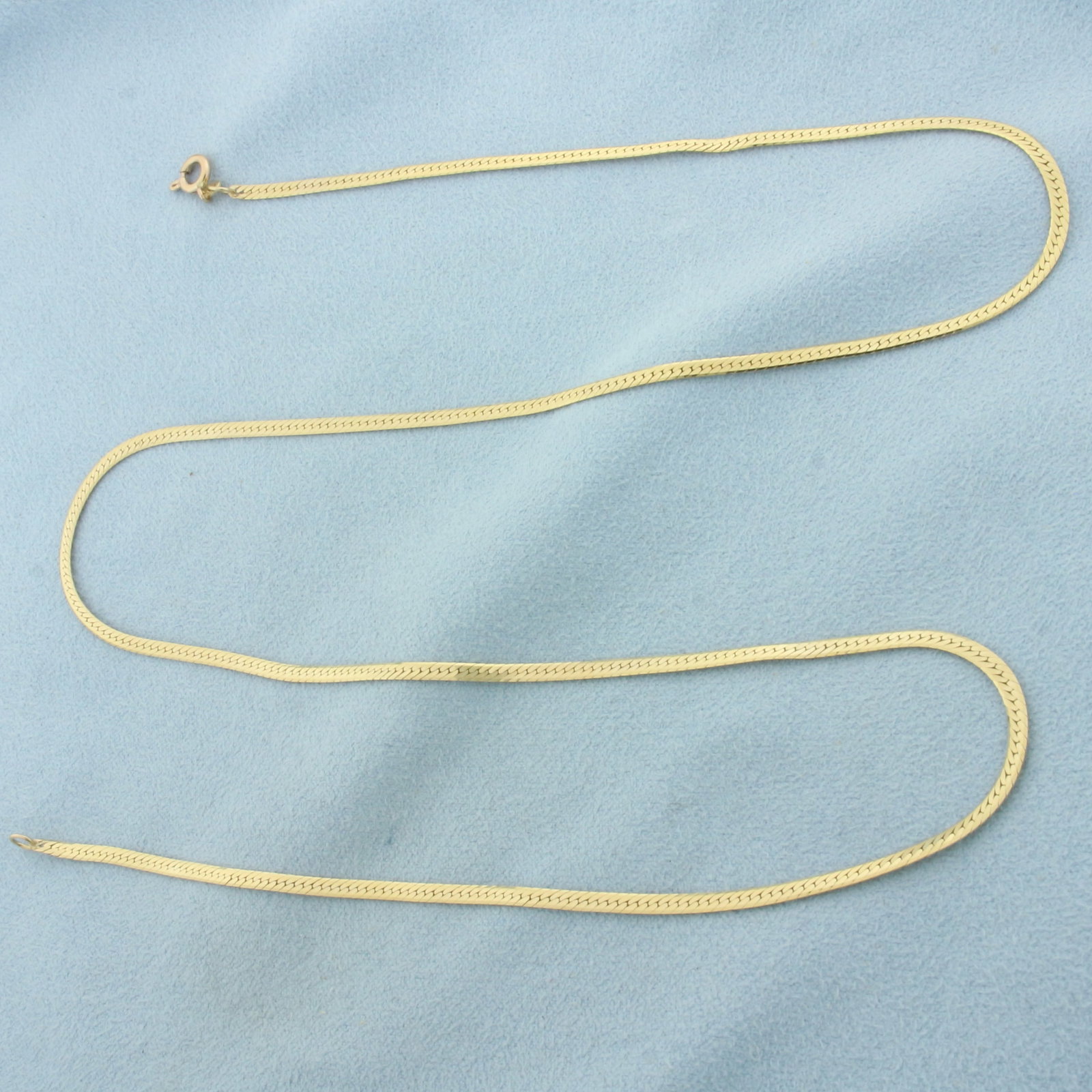 22 Inch Italian Herringbone Link Chain Necklace in 14k Yellow Gold: In 14k yellow gold. 22 In long x 2.0mm wide. Spring clasp. 5.3g.