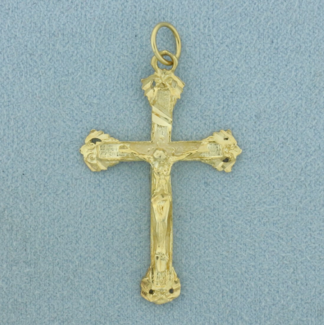 Crucifix Cross Pendent in 14k Yellow Gold: In 14k Yellow Gold. 1 1/2 Inch long x 7/8 Inch wide. 2.5g.