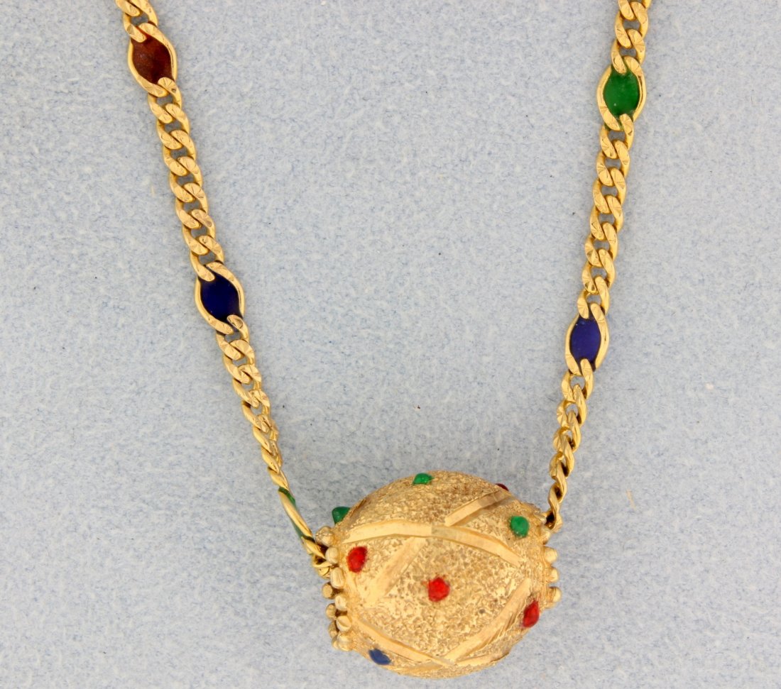 14k yellow gold necklace with Ruby, Sapphires, and: Stunning 14k yellow gold necklace with Ruby, Sapphires and Emerald in chain and in ball pendant! 20" chain. There are cabochon cut Ruby, Sapphires and Emeralds in the ball. 8.8g