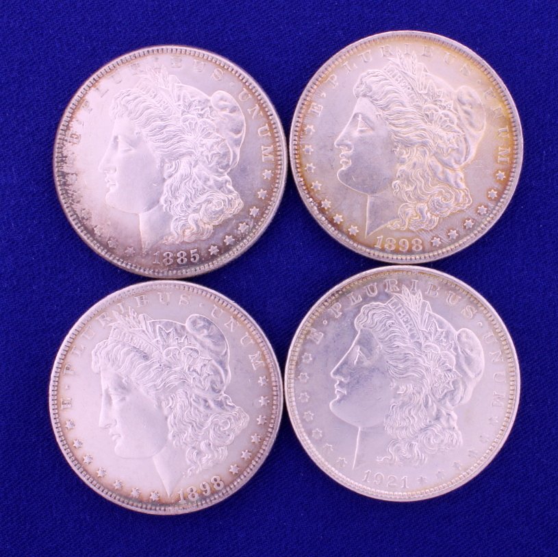 4 Silver Dollars: 4 US Silver Dollars-these are Morgan's that have some toning. Take a look at photo's and you can judge for yourself. Dates include 1898, 1885, 1898 and 1921.