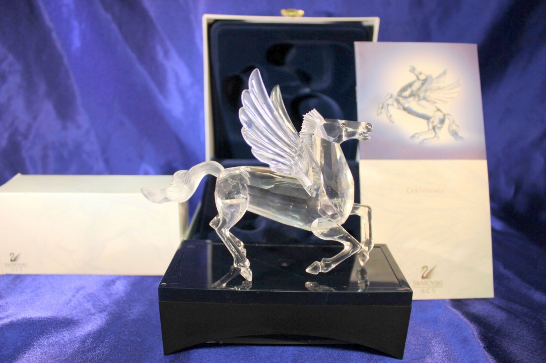 Swarovski Members Pegasus w/certificate, stand and box: This lovely Annual Edition designed by Adi Stocker is the third edition and final of the "Fabulous Creatures" series. It has tabac eyes. The SCS mark is laser etched and has AS98, the design year and