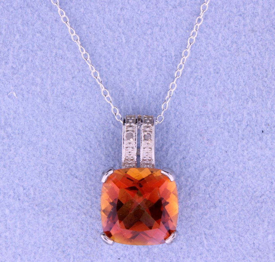 Sterling silver pendant with gorgeous Azotic and: What a gorgeous piece!! This vibrant 5 carat genuine cushion cut Azotic pendant that offers a kaleidoscope of colors is accented with 0.01 carats of diamonds and an 18” sterling silver chain 2.8g