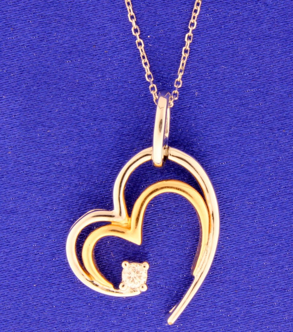 14k white and rose gold diamond heart necklace: 14k diamond open heart necklace white gold & rose gold. Diamond is 0.20 carat brilliant cut G-H color and SI clarity. I believe it to be out of Jane Seymour Collection. 4.1g