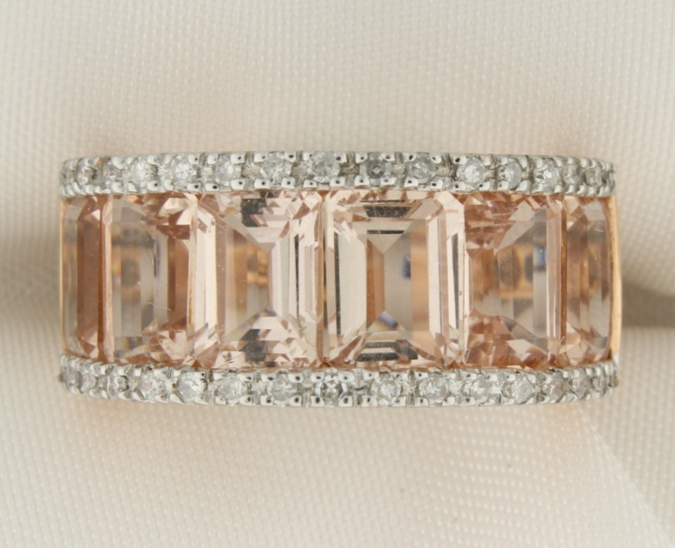 14k gold ring with Morganite and diamonds: Exquisite 14k rose gold ring with 5.4 carats of Morganite and accented with 0.24 carats of diamonds 5.8g Size 6