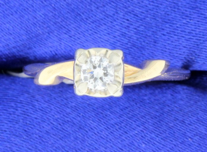 Vintage Diamond Ring: Lovely Vintage diamond ring set in 14k yellow gold with 14k white gold head. Center diamond is 0.18 carats, G color and VS clarity. 1.8g Size 5 1/4