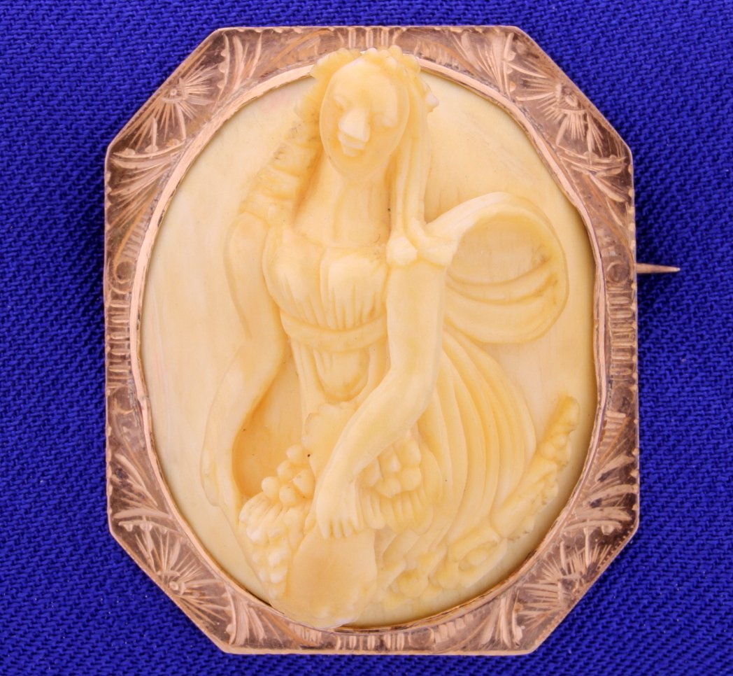 Antique 14k Gold Carved Bone Cameo: Beautiful Antique Carved Bone and 14k Gold Cameo of a woman picking grapes. This is a very deep carving, very 3 dimensional. 12g total weight and measures approx 1 1/2 x 1 1/4" We believe this to be C
